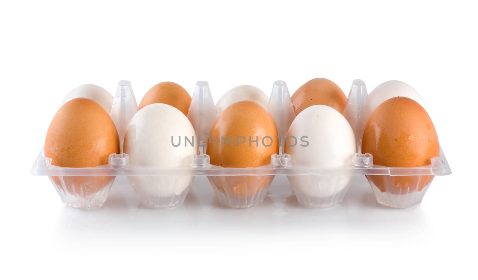 Tray of eggs isolated on white background