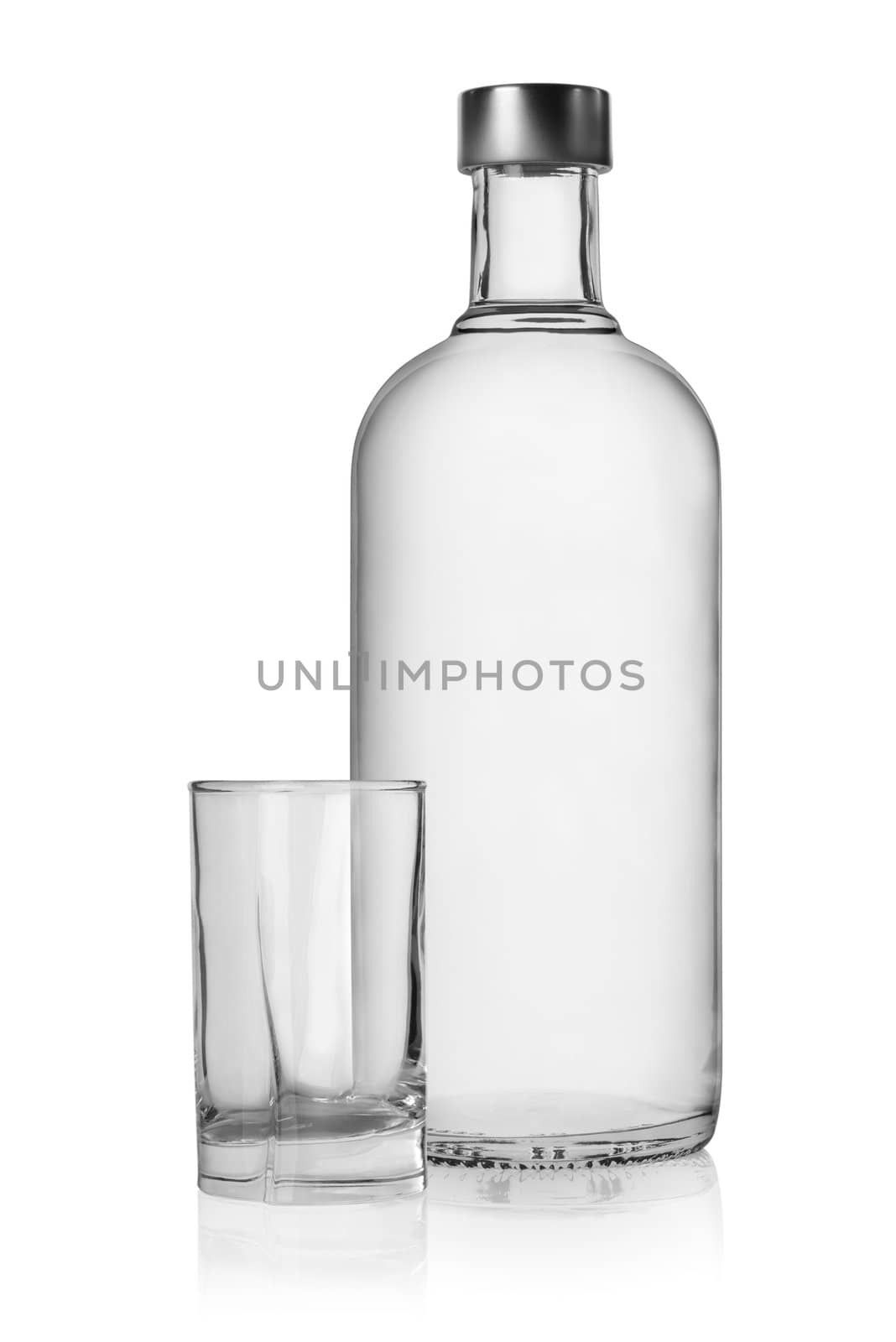 Bottle and glass of vodka isolated on a white background