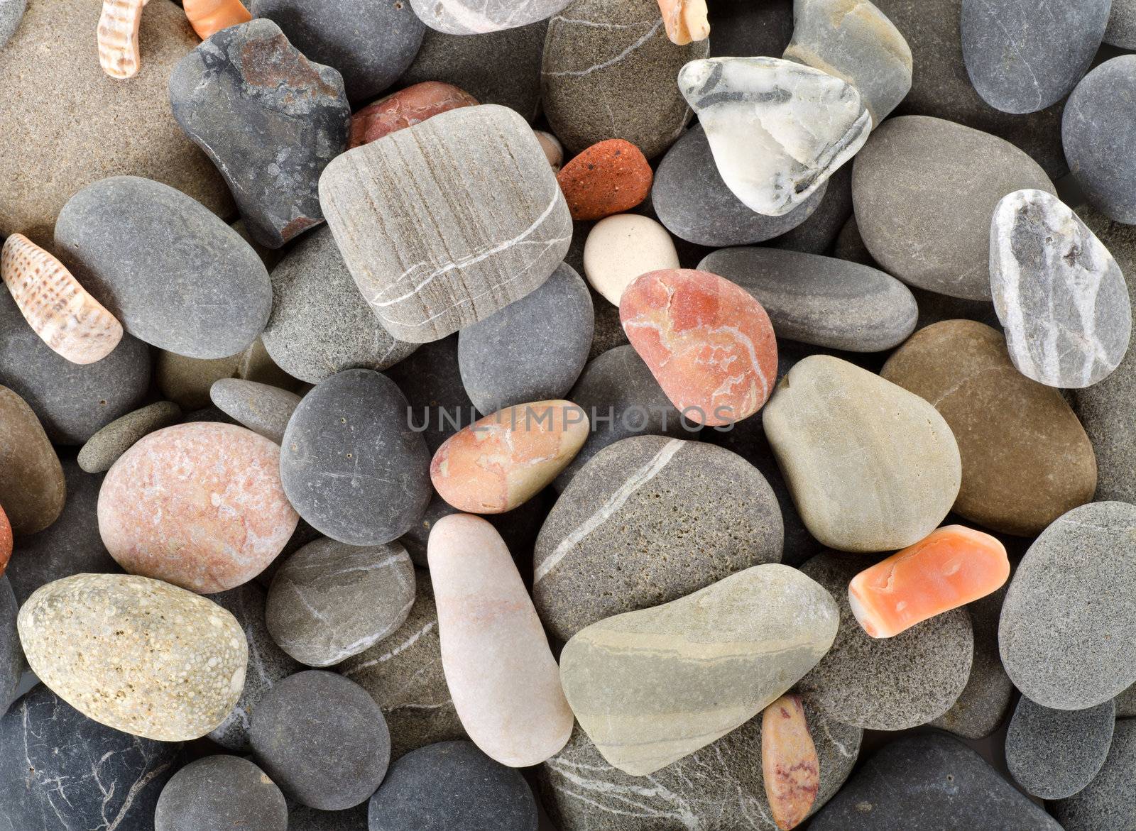 Background shot of pastel colored stones. Shot on the shore of black sea.