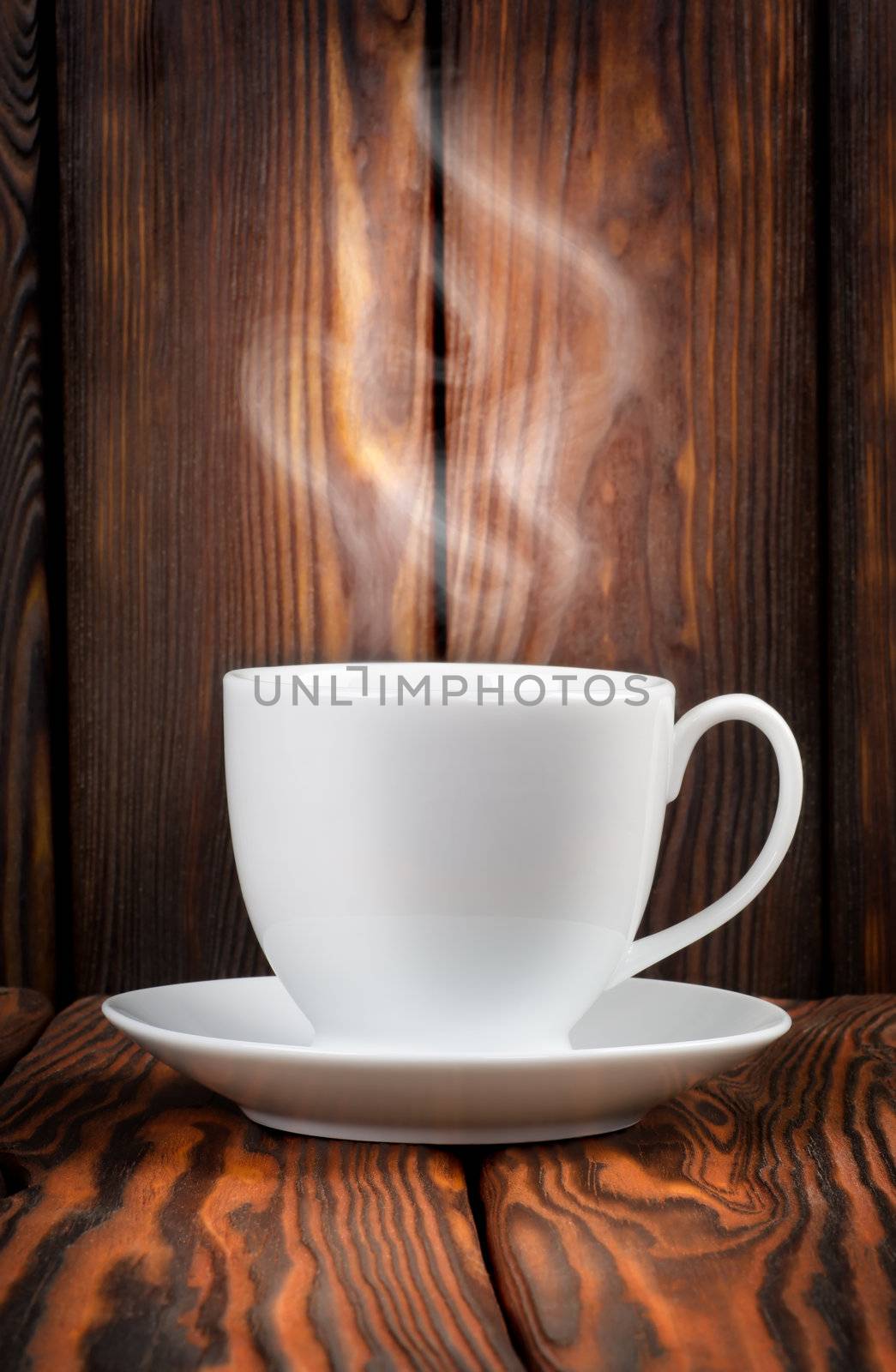 White cup with steaming hot drink by Givaga