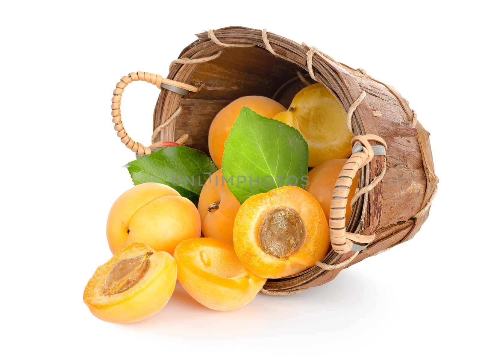 Apricots in a basket isolated on a white background