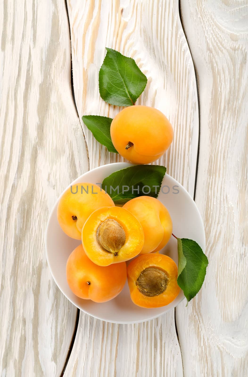 Apricots on the plate by Givaga