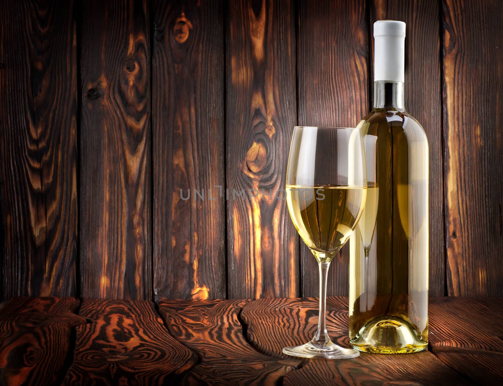 Desser white wine on a wooden background