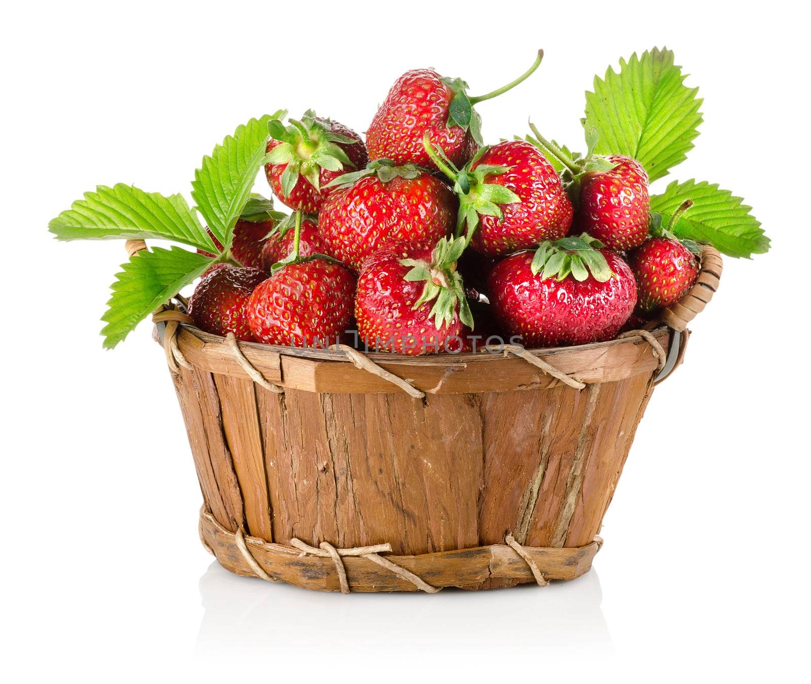Strawberries in a wooden basket isolated on a white background