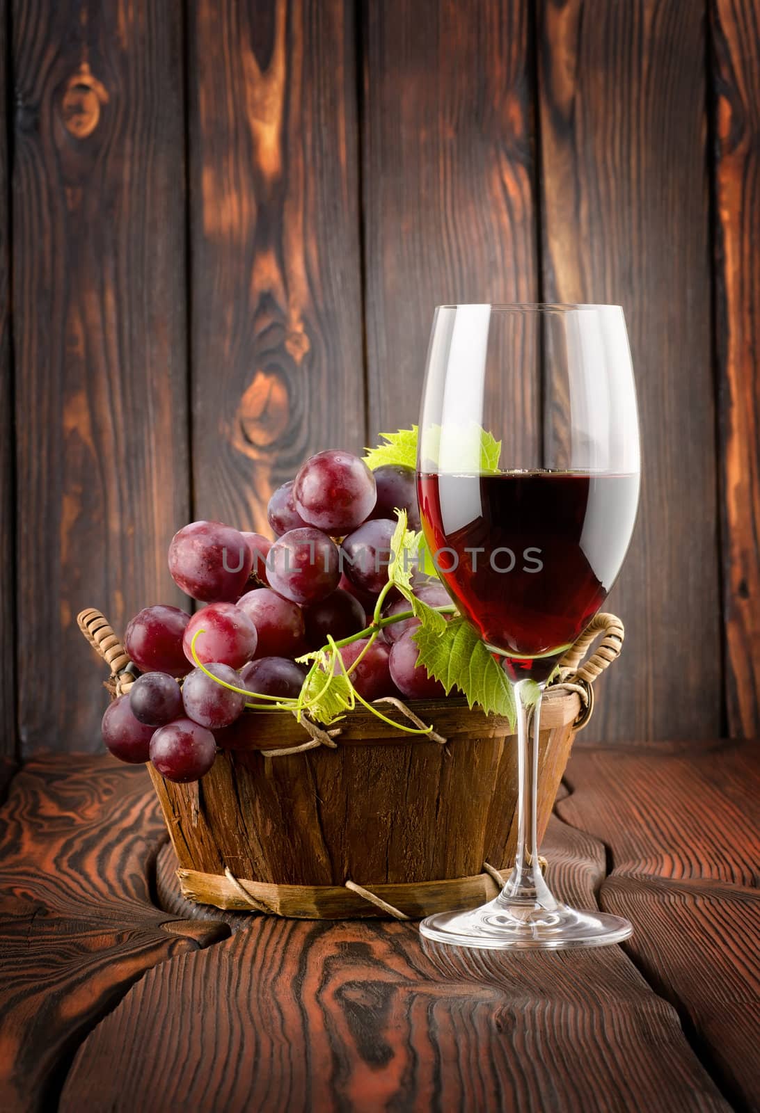 Wine glass and grapes in a basket by Givaga