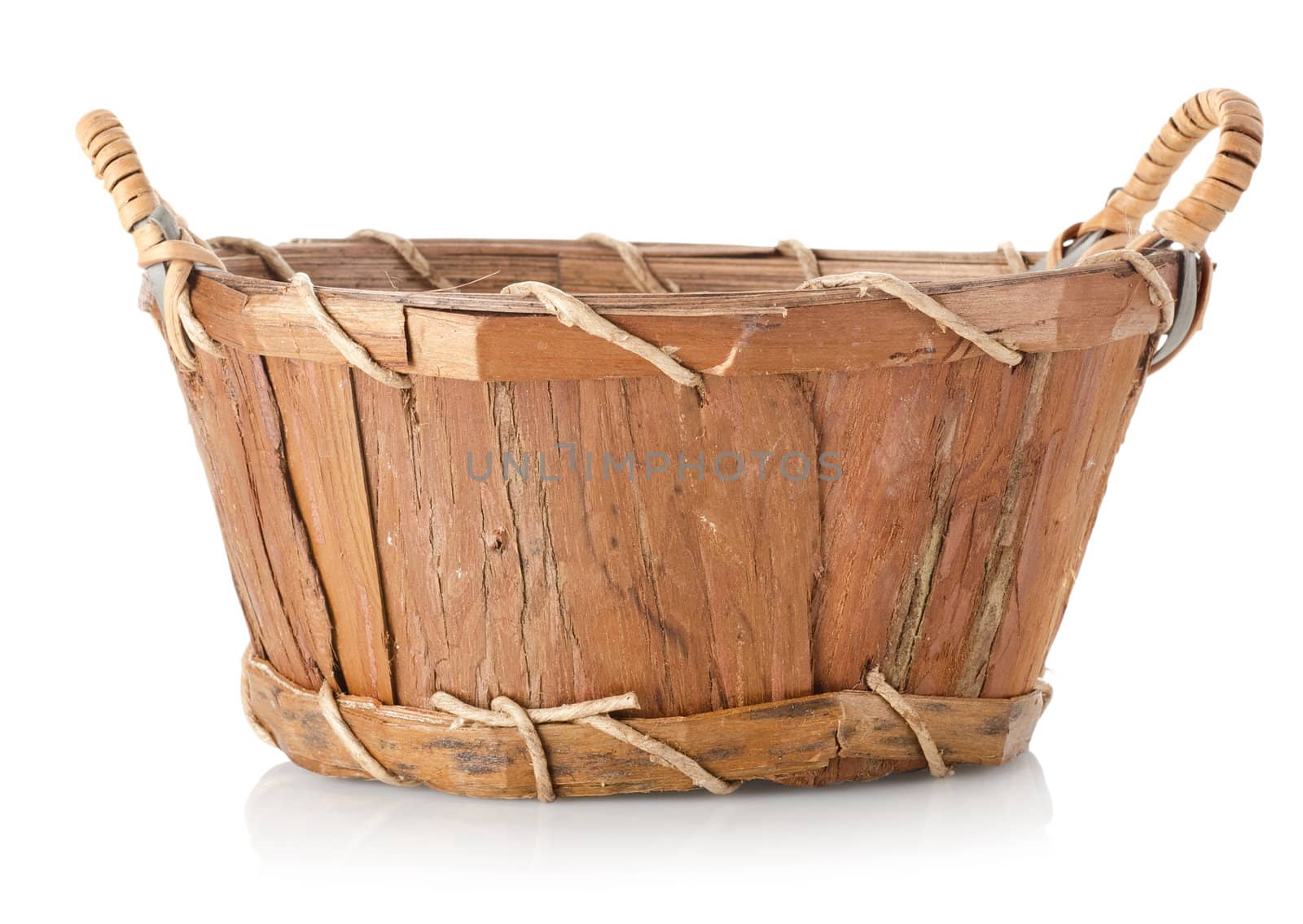 Wooden wattled basket isolated on a white background