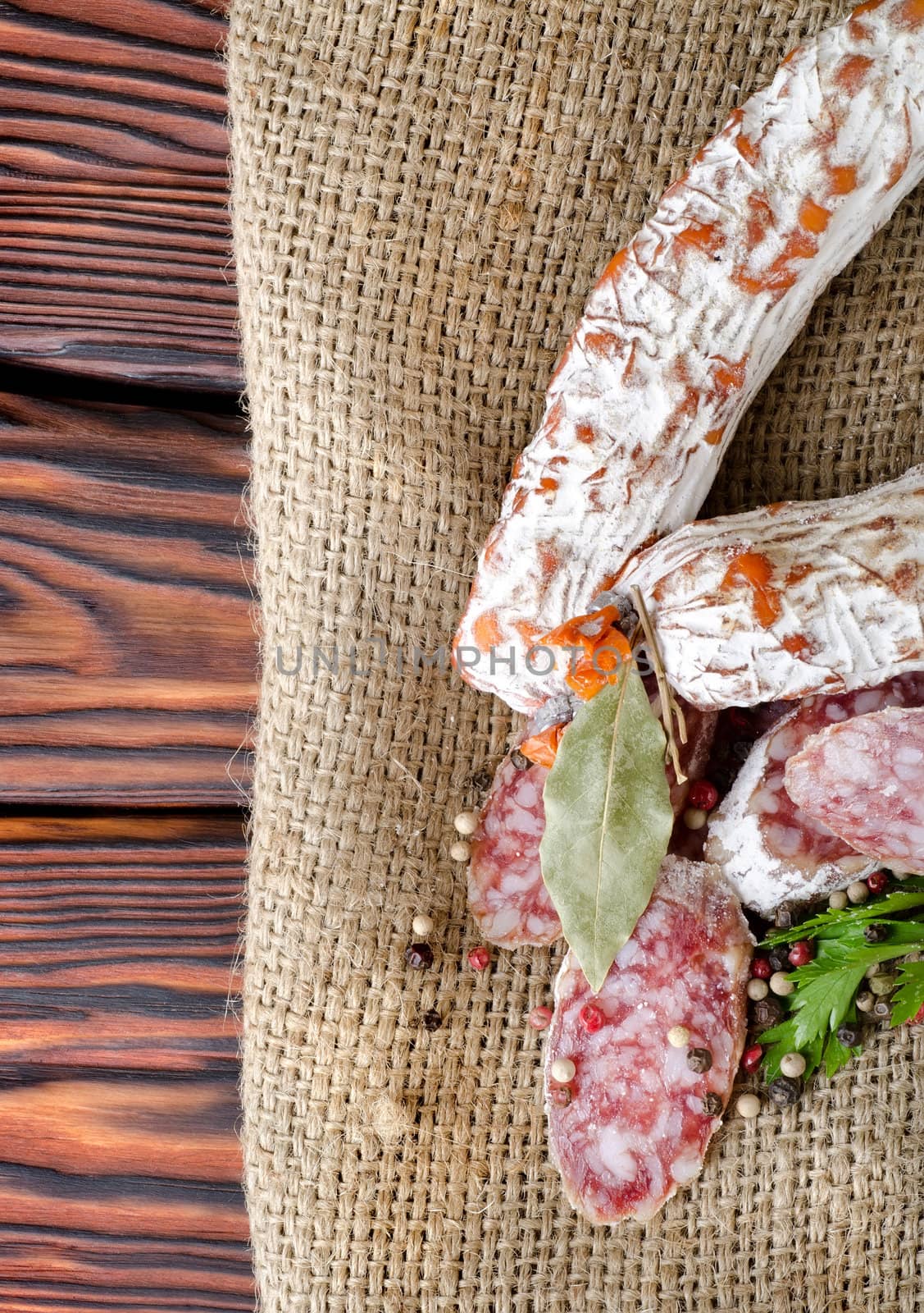 Salami sausage and spices in the tissue