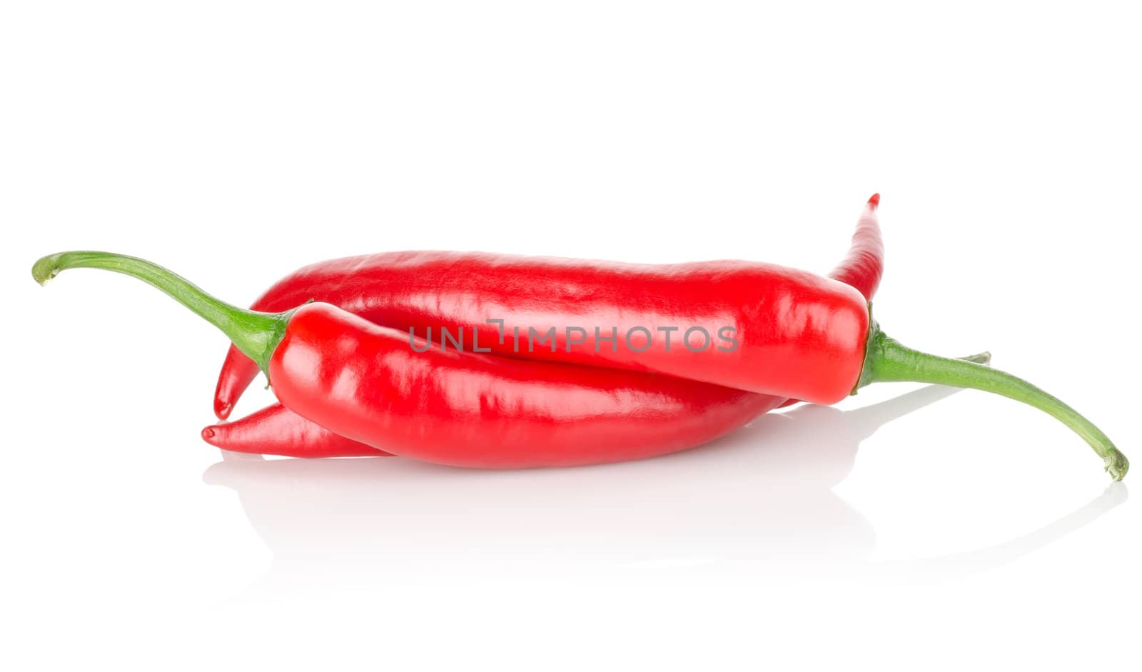 Three chili peppers isolated on a white background