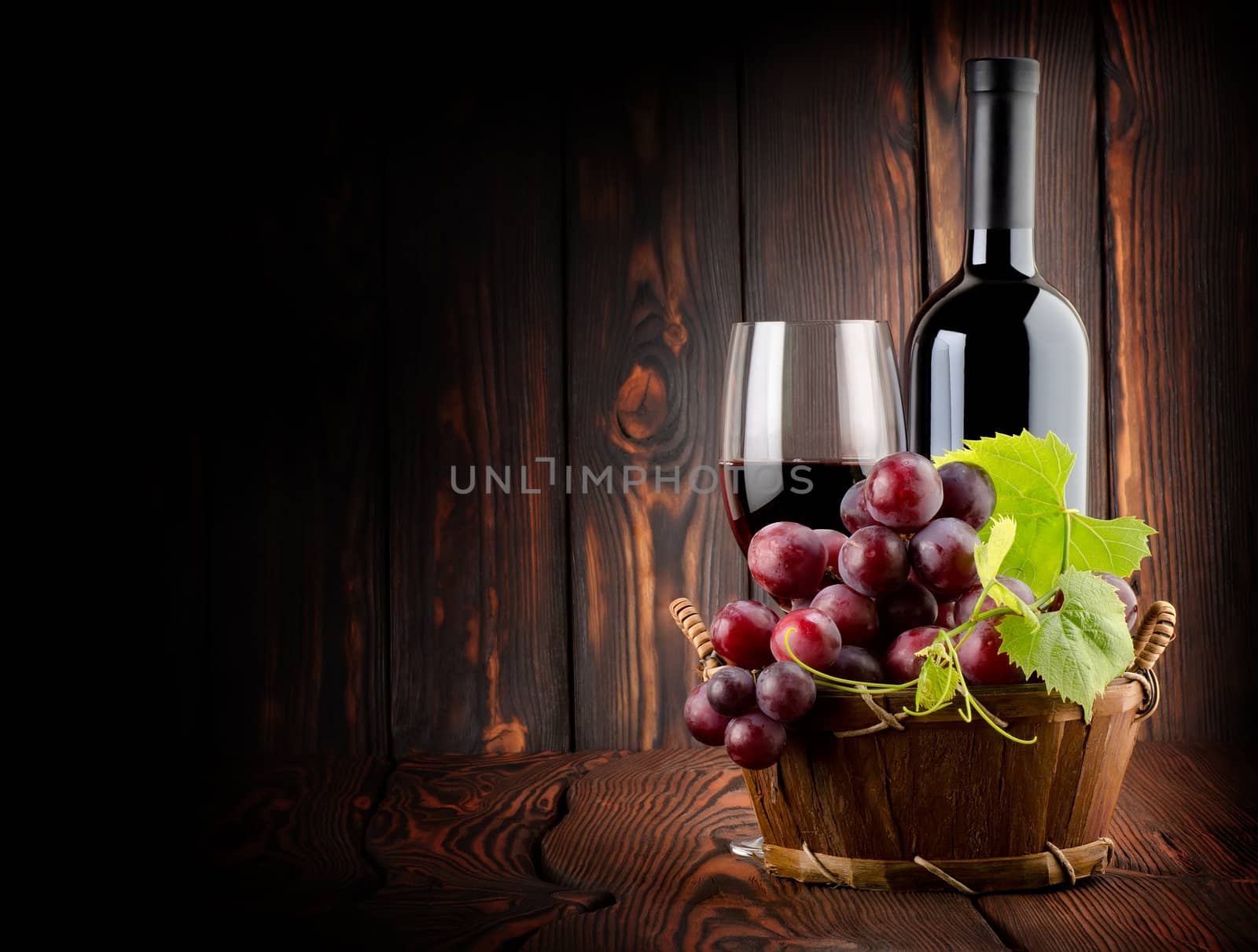Wine on the old wooden background by Givaga