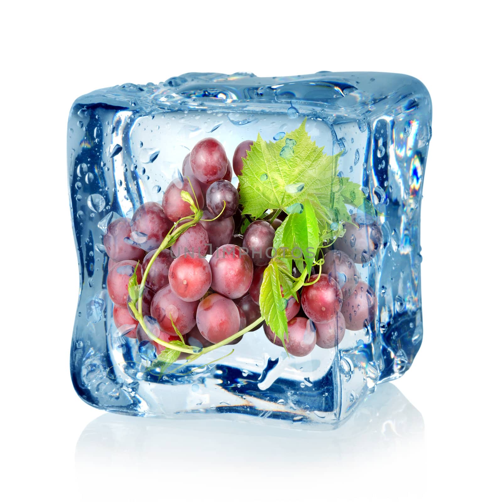 Ice cube and blue grapes isolated on a white background