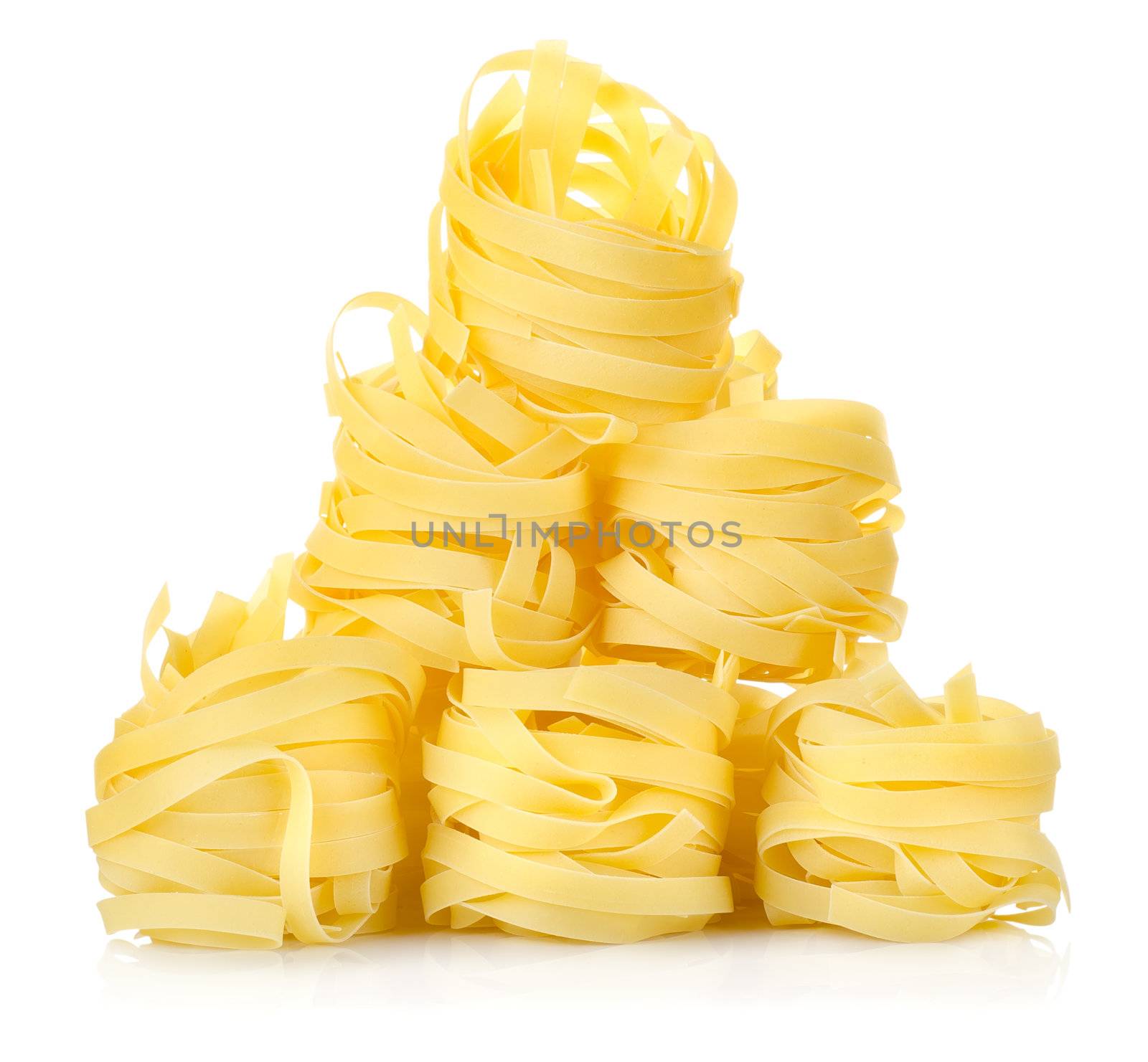 Pile of pasta tagliatelle isolated on white background