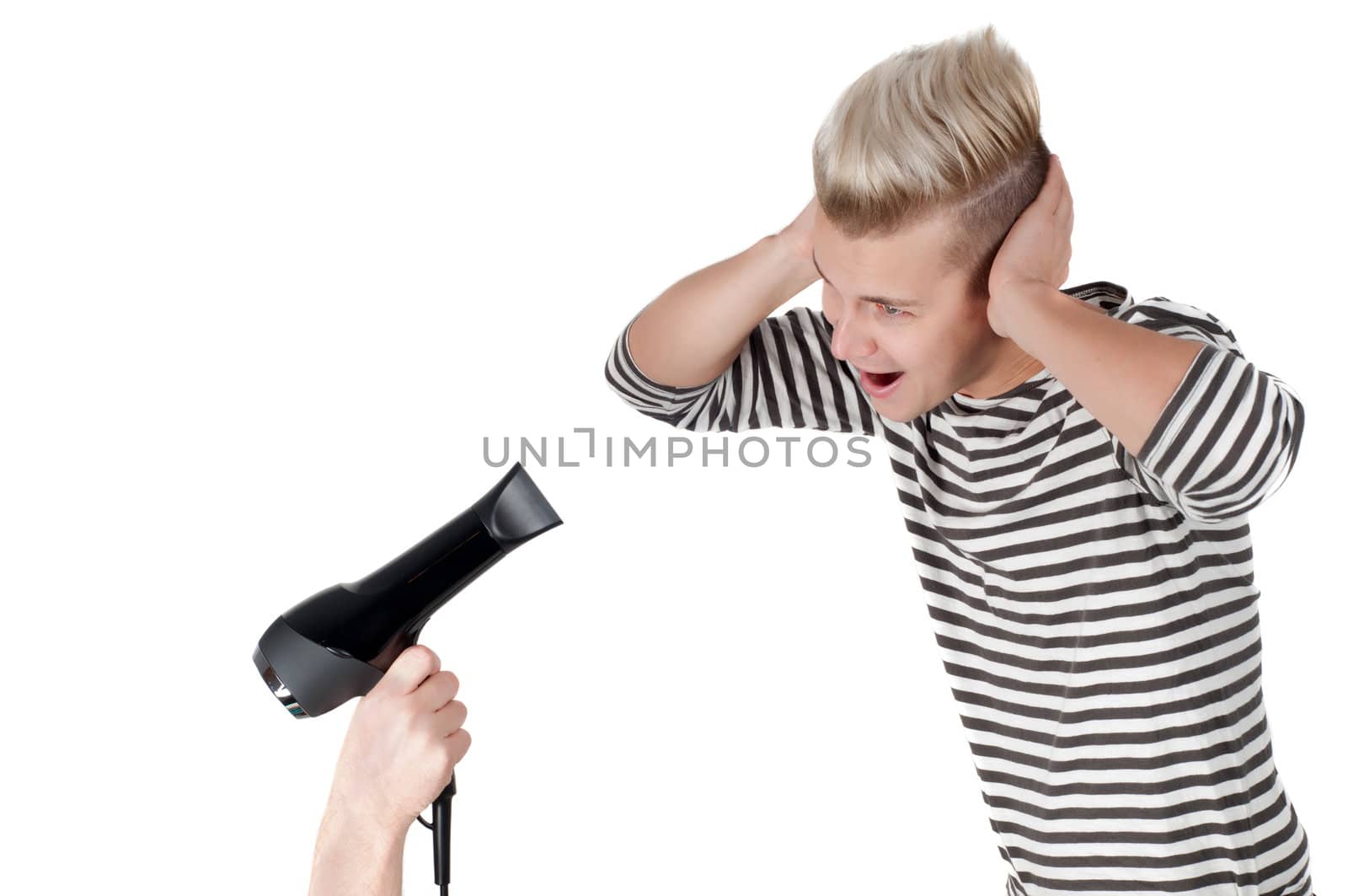 Handsome man in striped t-shirt with hairdryer