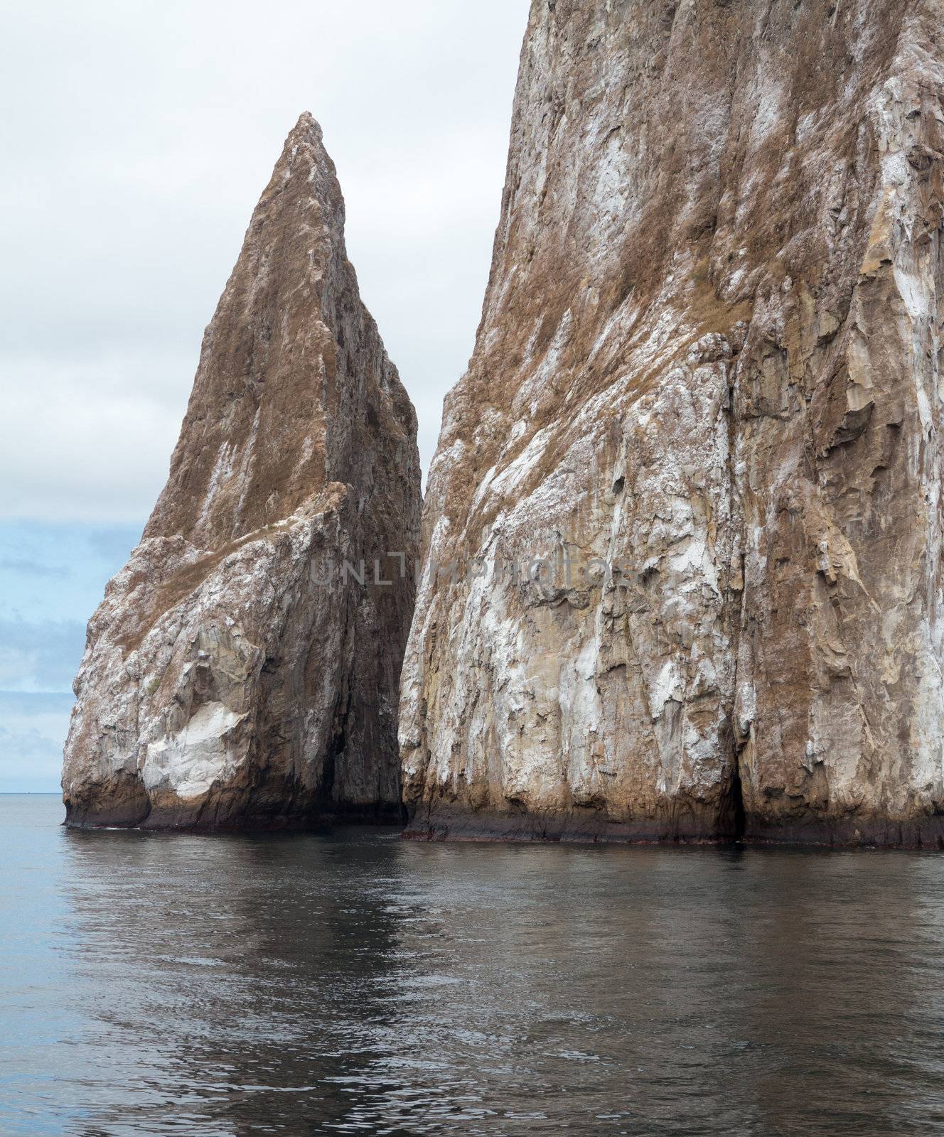 Sleeping Lion or Leon Dormida rock formation off coast of Galapagos islands