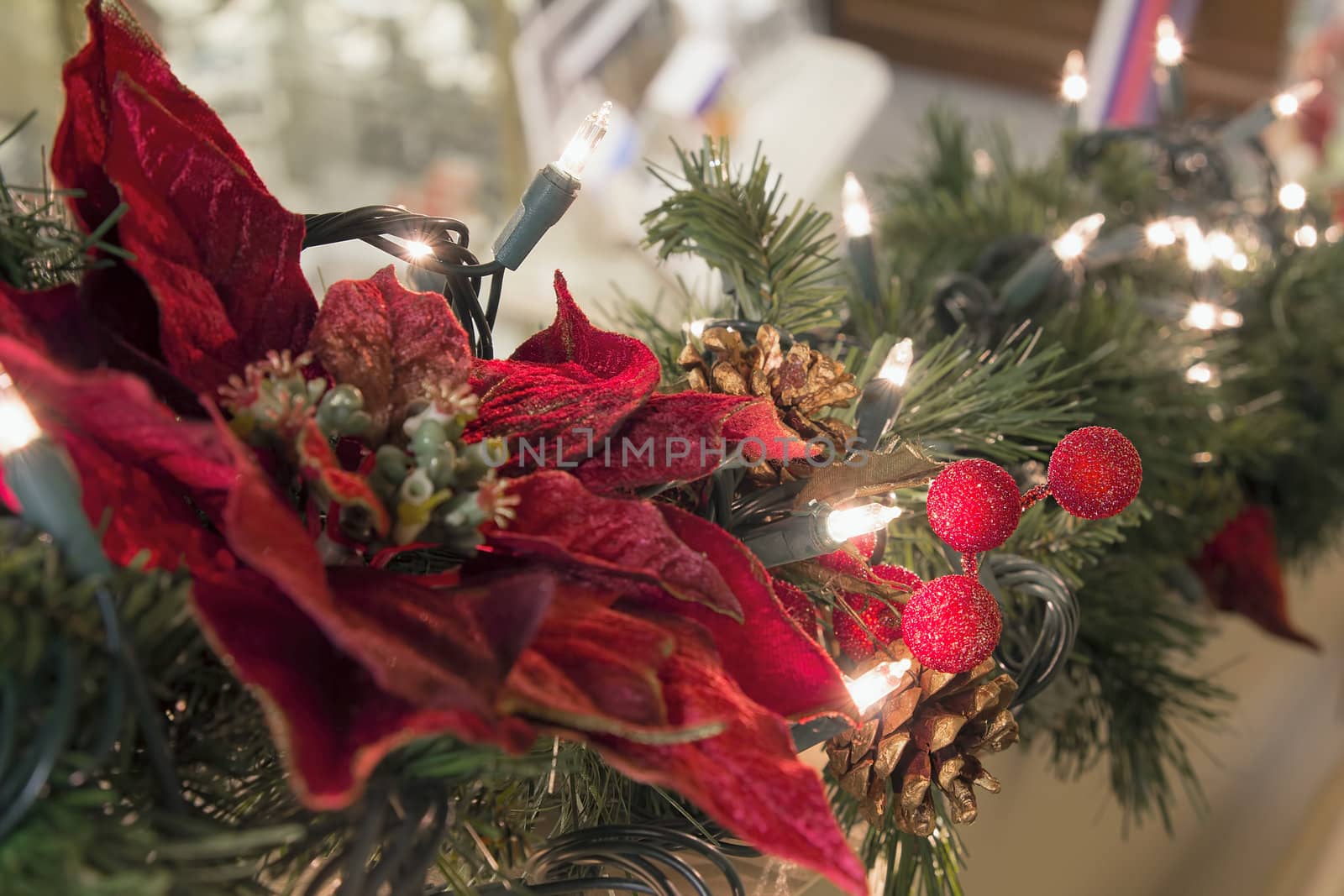Christmas Decoration Garland with Poinsettia Pine Cones and Lights on Staircase