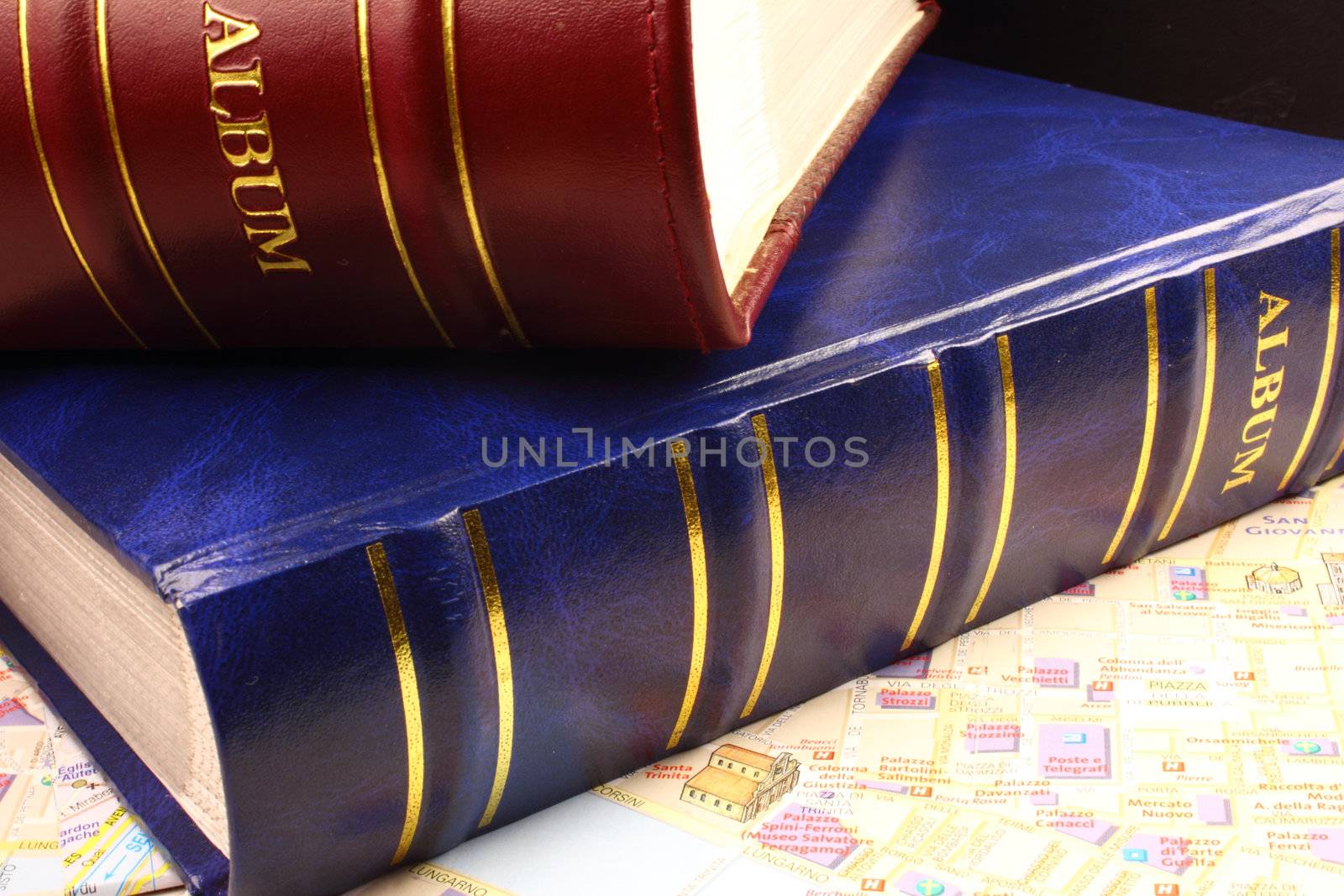 Two photo albums on city map.