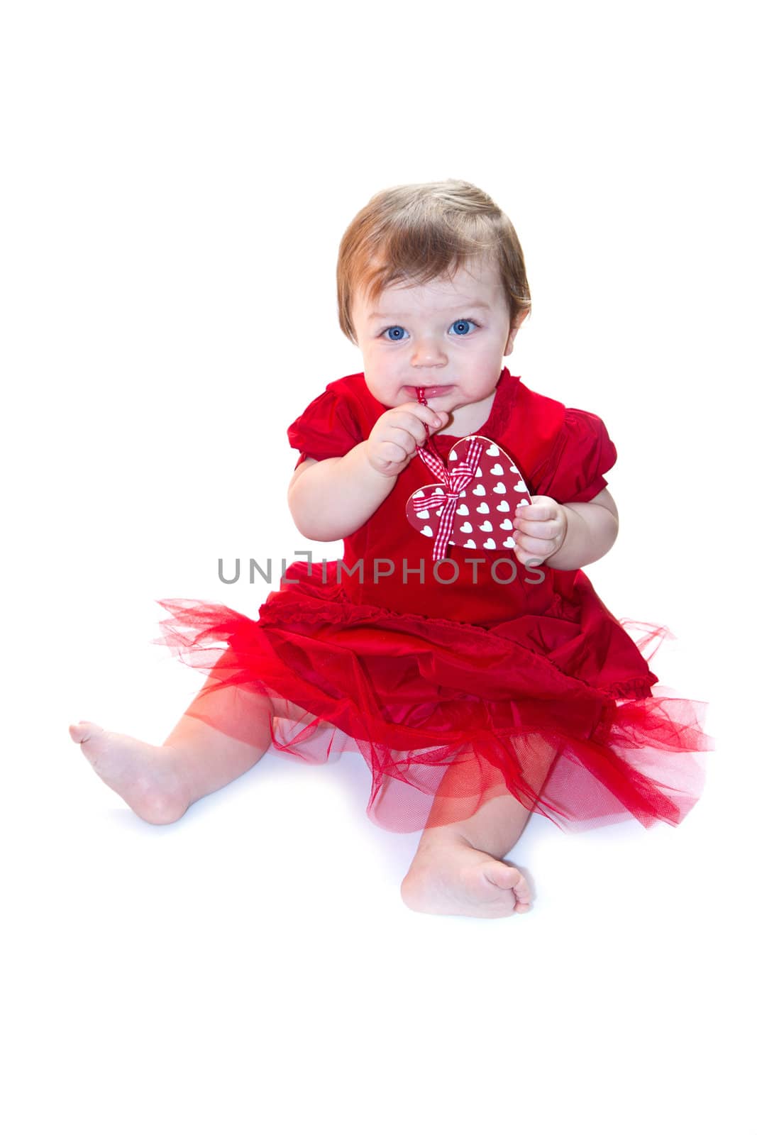 portrait of baby girl in red by lsantilli