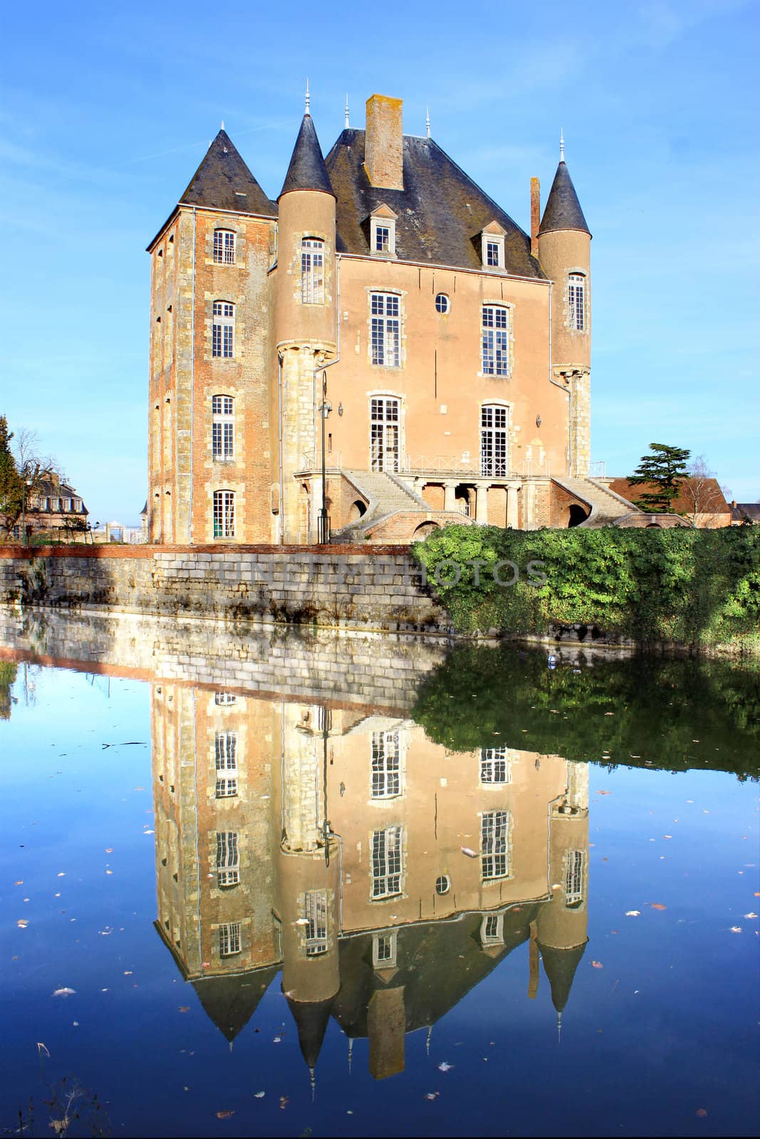 a castle with its moats, its park and garden with its towers and its ancient architecture