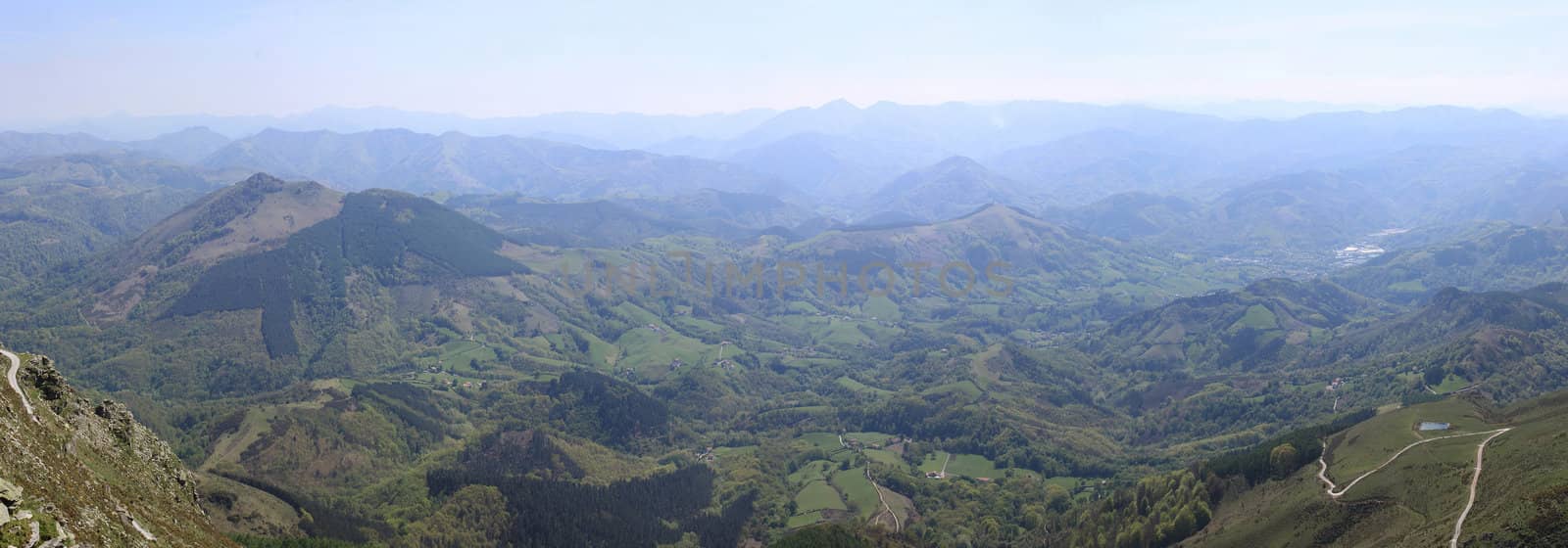 an aerial and panoramic mountain tops