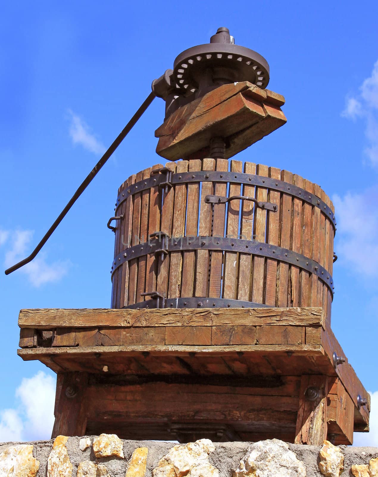 a grape press to extract the juice of grapes to produce wine