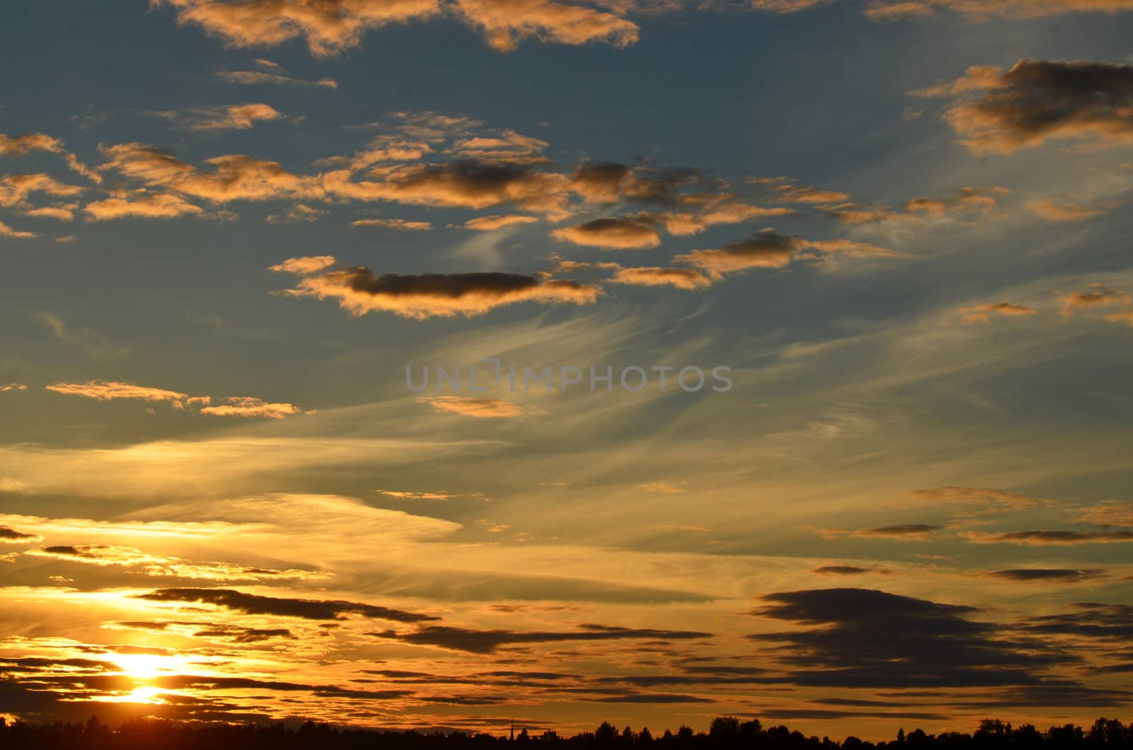 The sun shines on the clouds at sunset