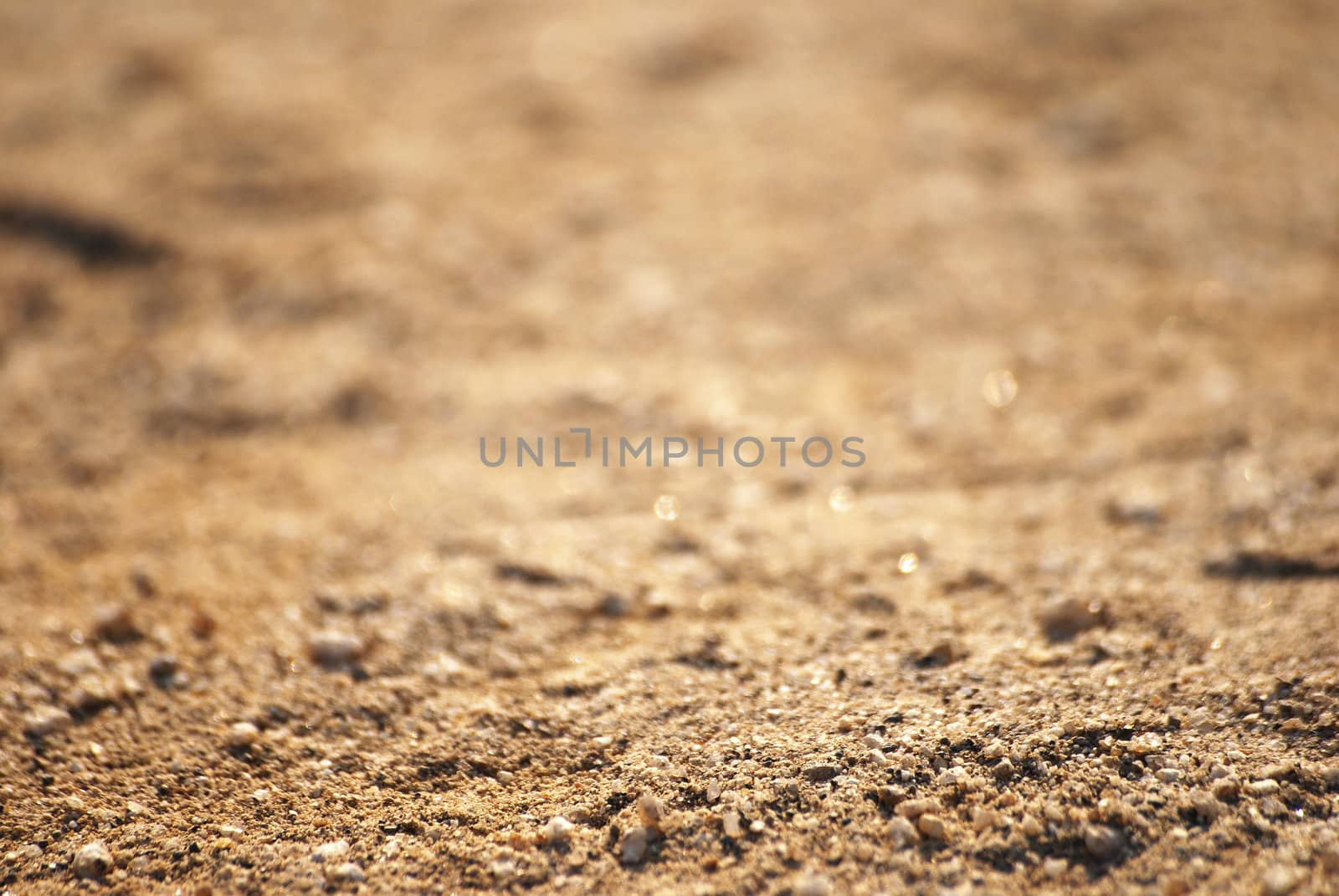 crystal yellow sand macro background, sharp focus is on the foreground part only