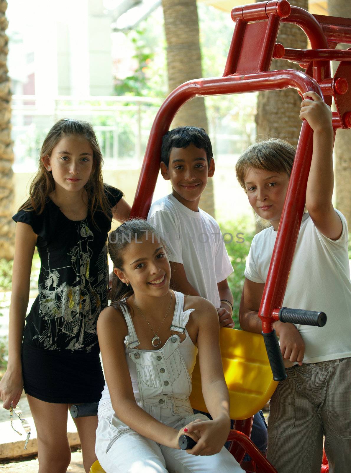 Children on playground in summer day .