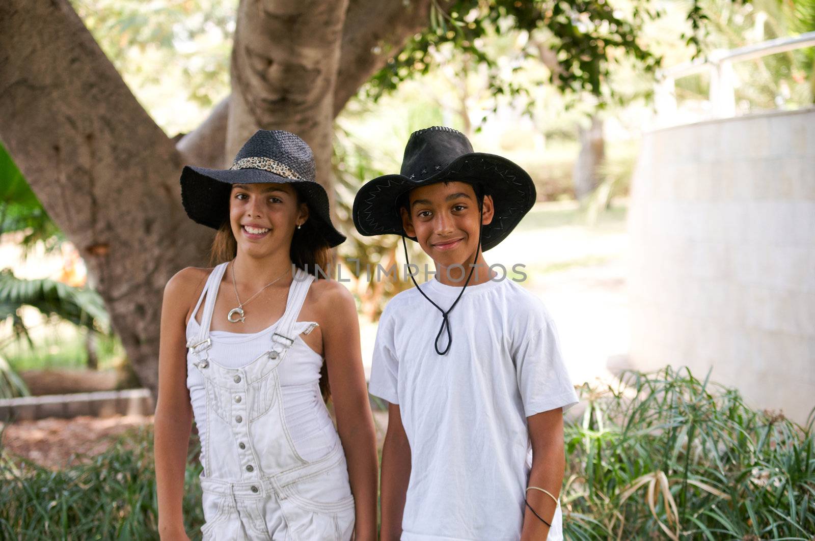 Boy and girl walking through the park.