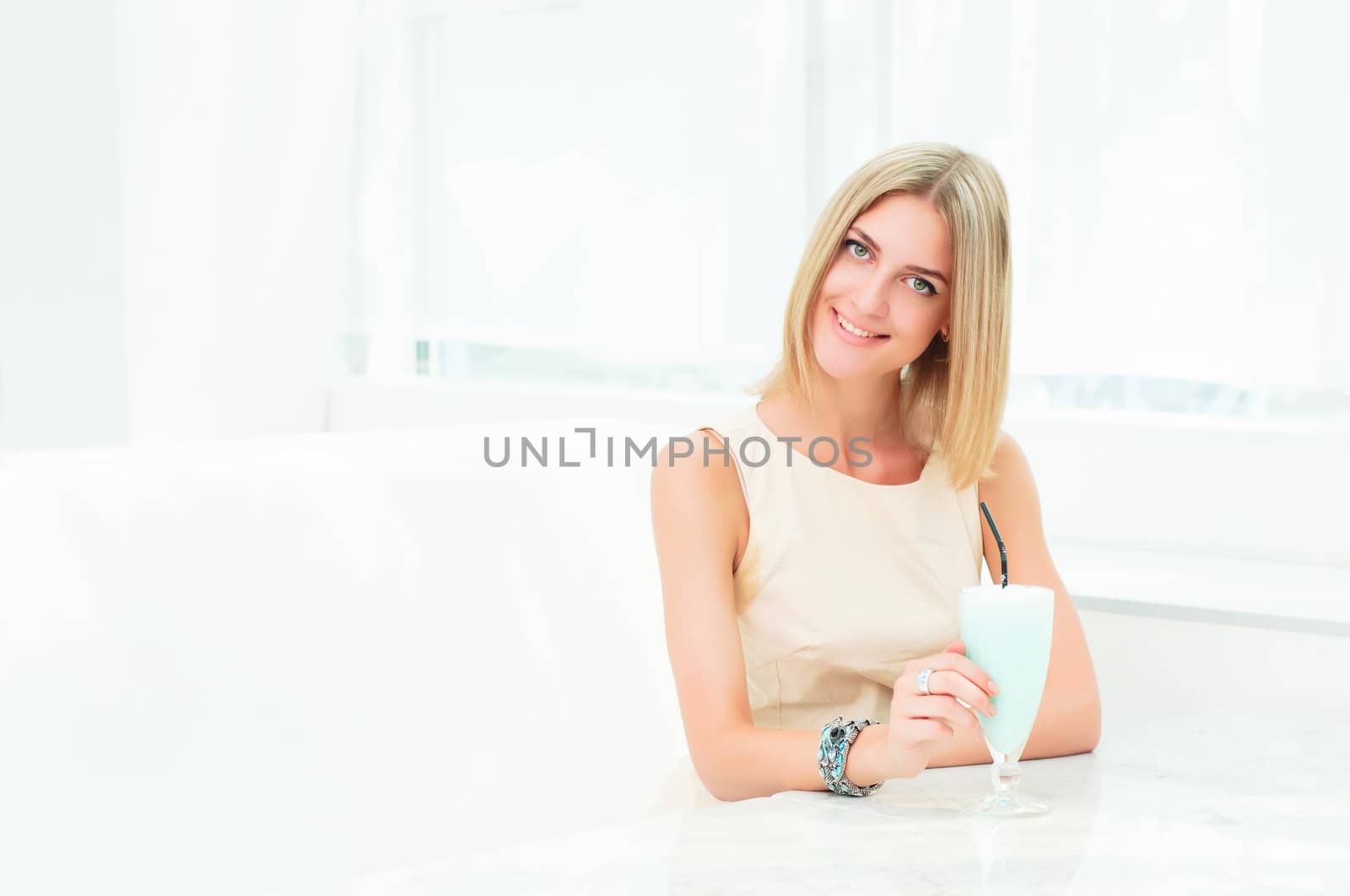 Portrait of a cute woman in urban cafe. bright colors, urban lifestyle