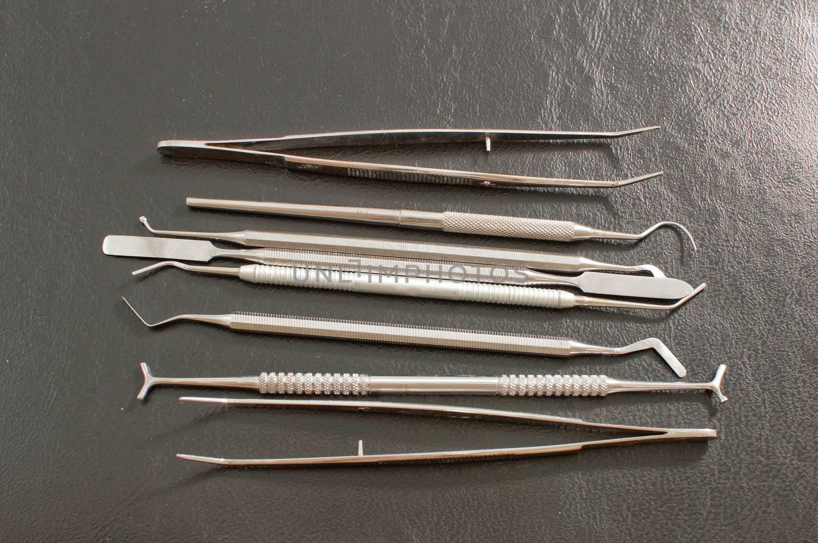 Set of metal medical equipment tools for teeth dental care .