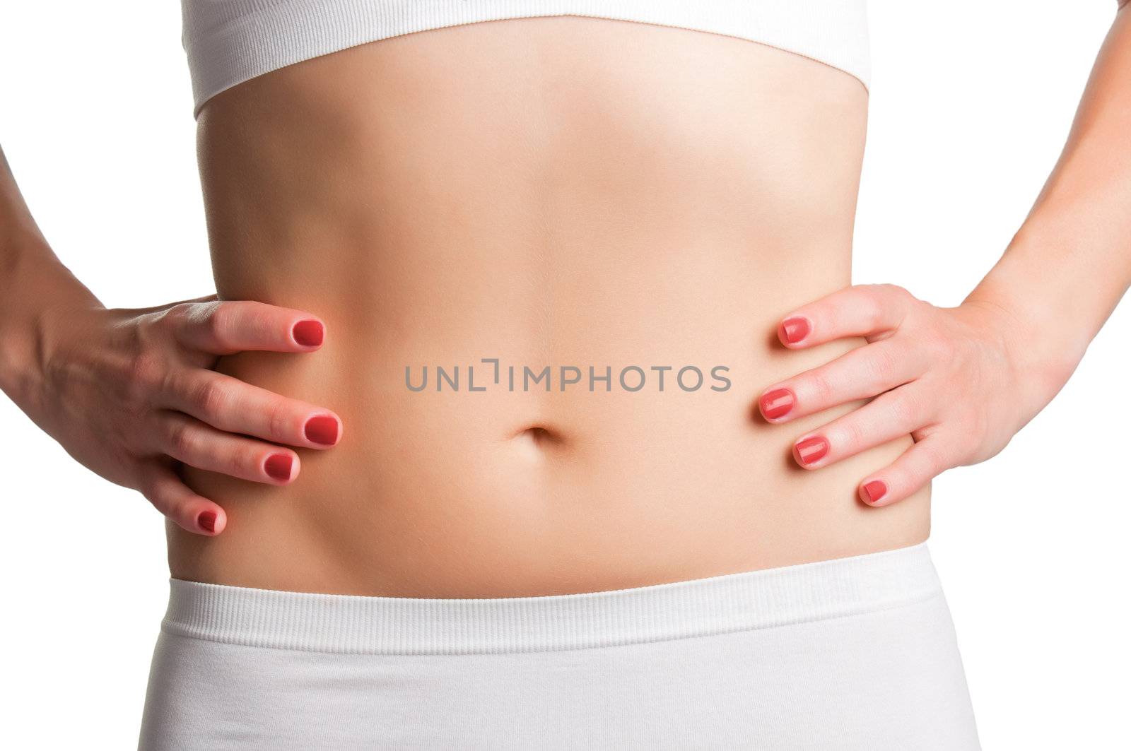 Closeup of a fit womans abs isolated on a white background