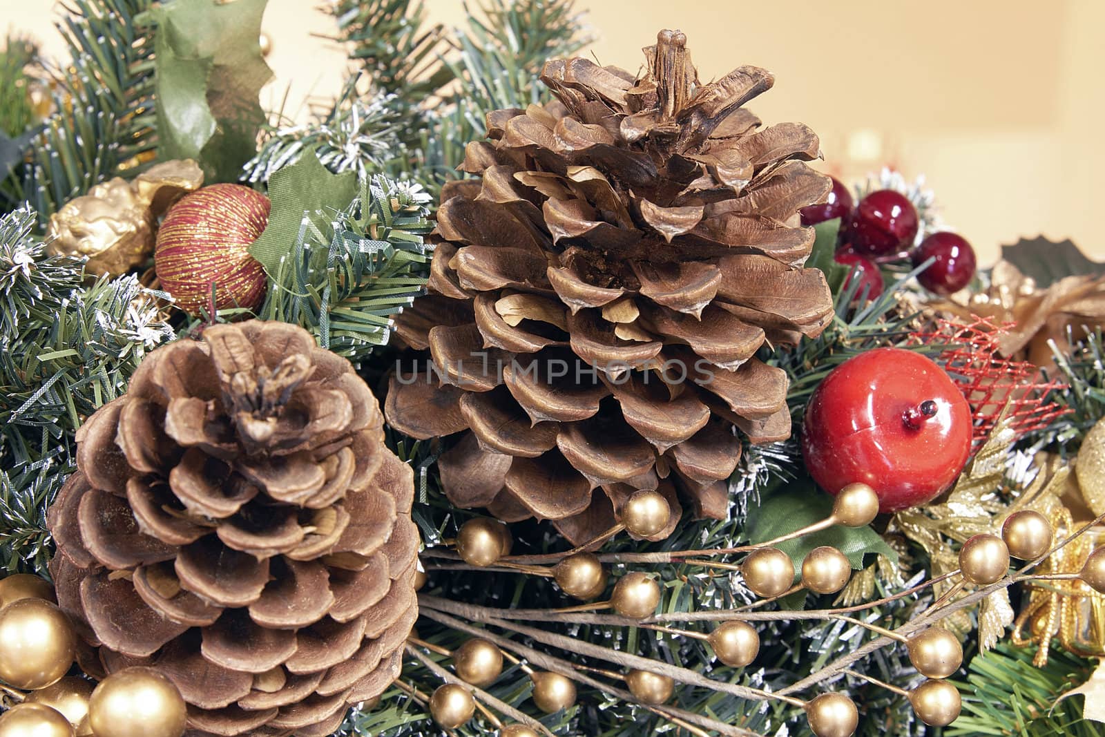 Christmas Tree Garland Decoration with Pine Cones and Artificial Berries Closeup