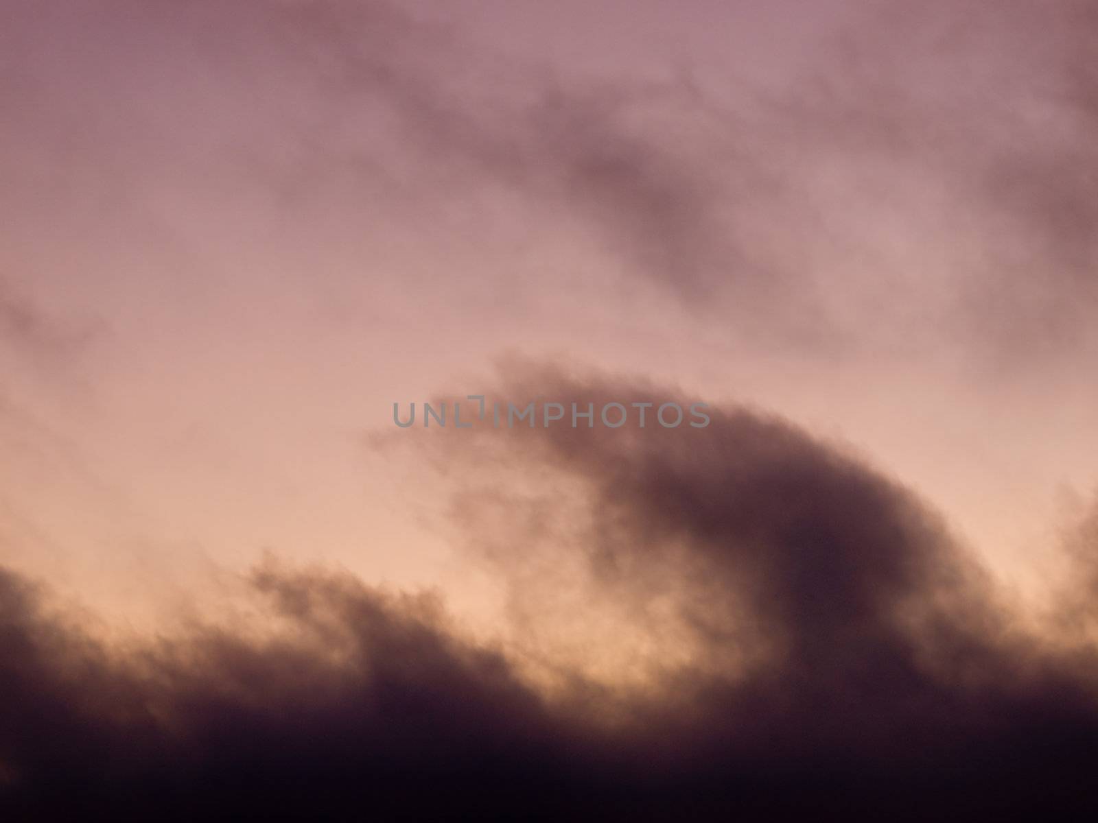 Lavendar Pink Clouds in the Sky at Sunset at the Beach