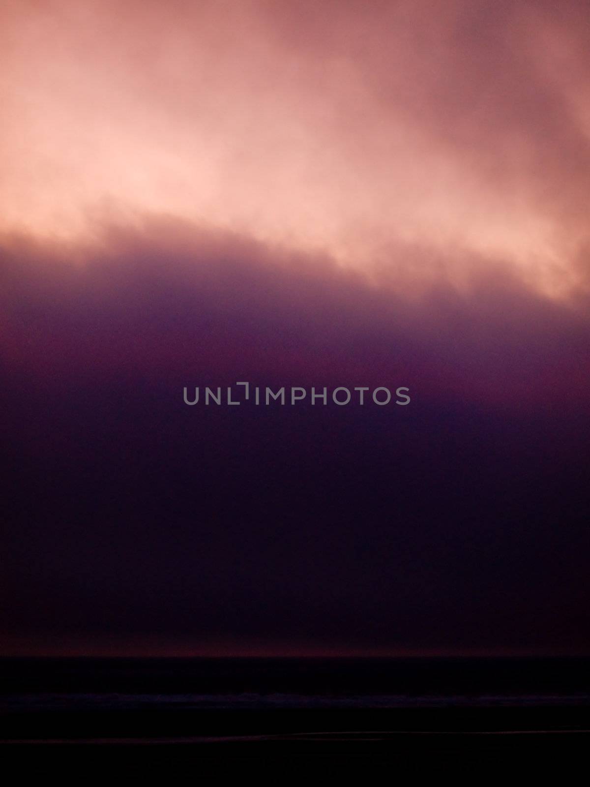 Lavendar Pink Clouds in the Sky at Sunset at the Beach