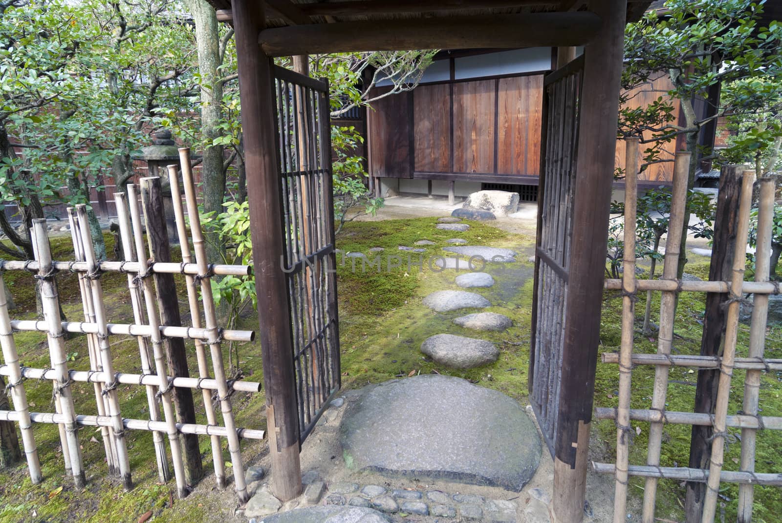 stone steps and open gate in Japanese Zen garden in Kyoto