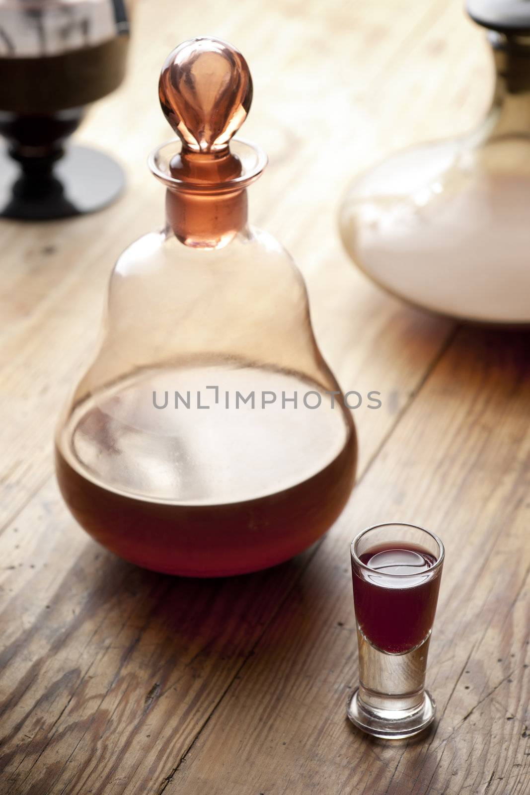 Old antique carafe and glass of liqueur.  Traditional Polish aged nalewka.