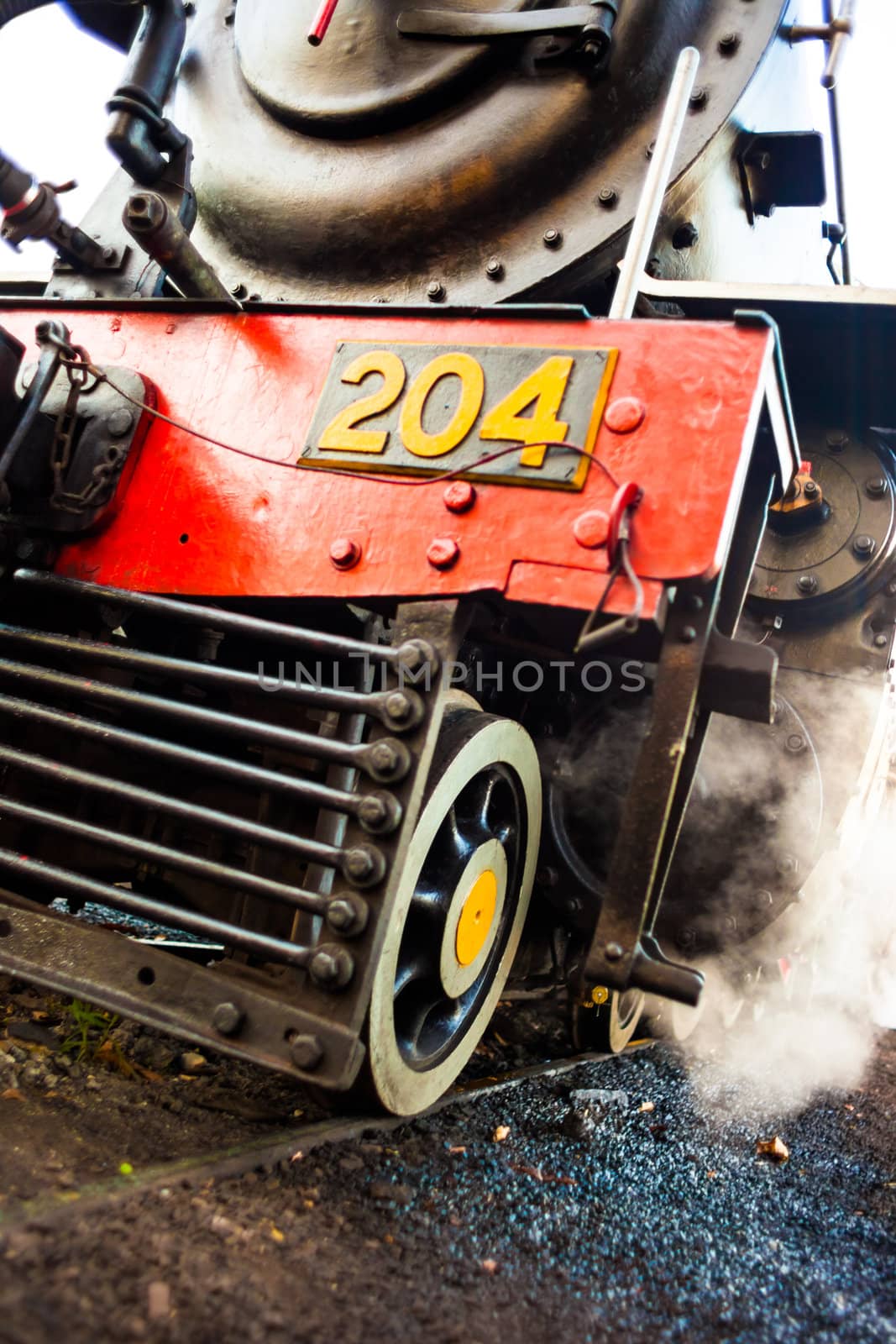 Wheels and cowcatcher of a steam locomotive