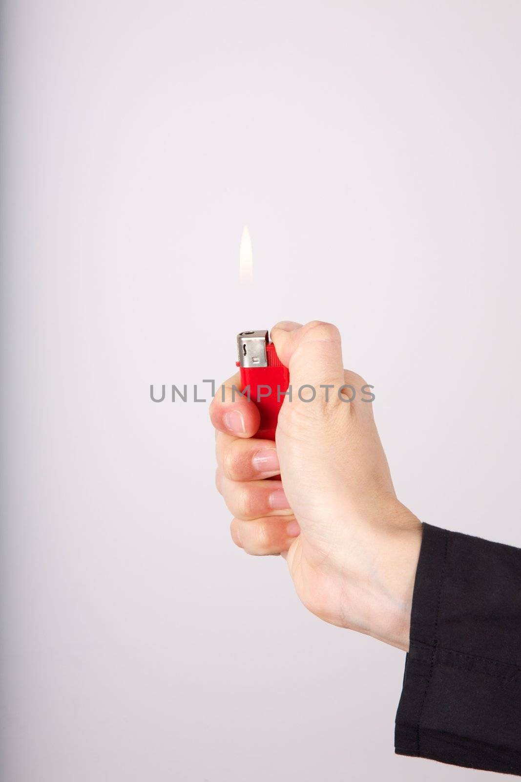 woman detail holding a red lighter in her hand