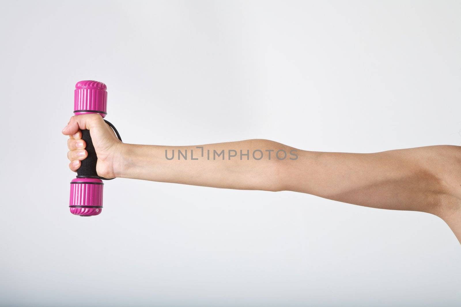 woman arm at gym lifting dumbbells over white background