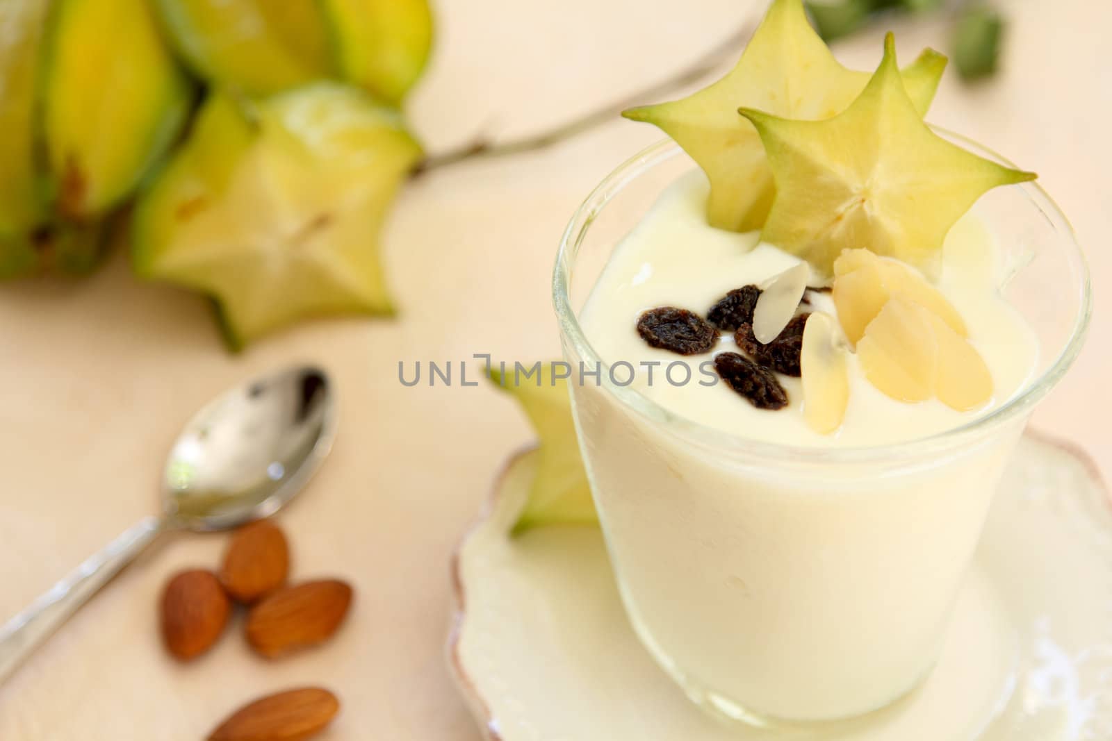 Healthy breakfast [yogurt with almond and starfruit ]