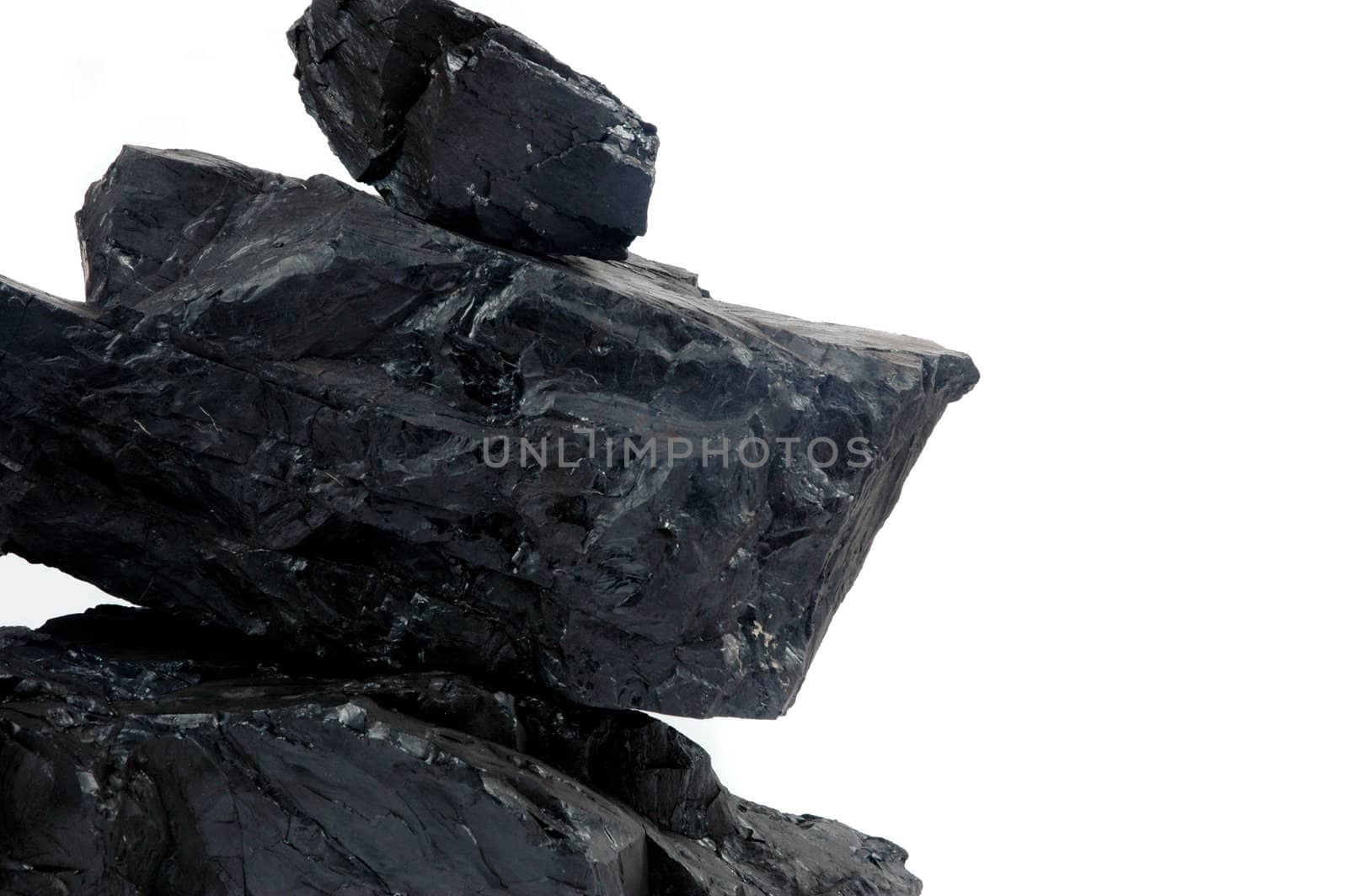 pile lumps of coals isoated on white background