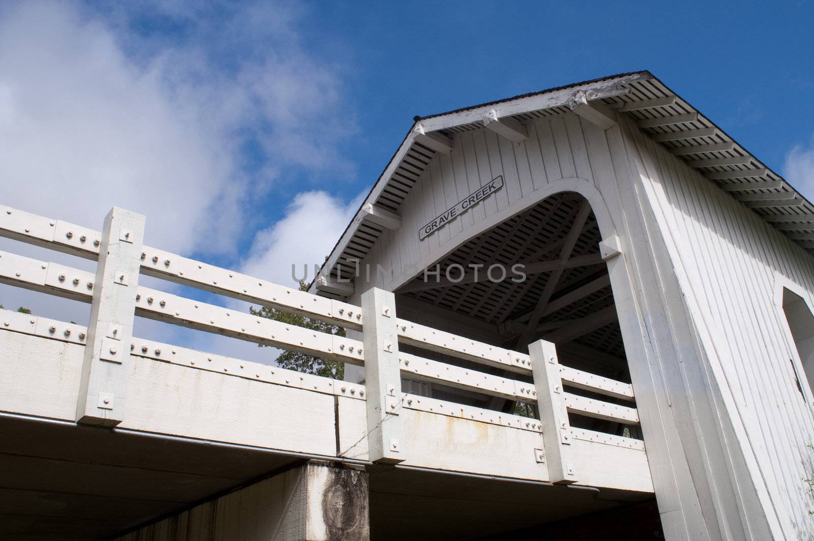 Road emerges from Grave Creek Covered Bridge