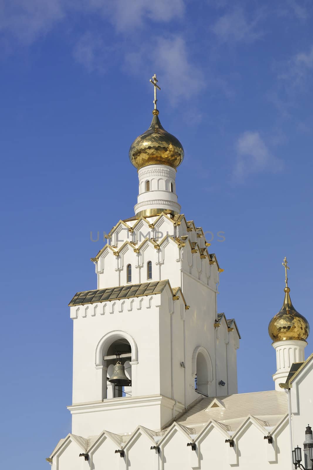 bright Orthodox Church under clear blue sky; All Saints orthodox Church in Minsk, Belarus