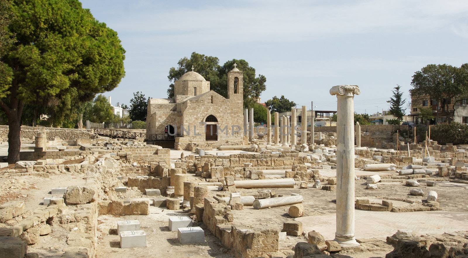 Ancient world meets present, old pillars close to modern church, Paphos, Cyprus, Europe