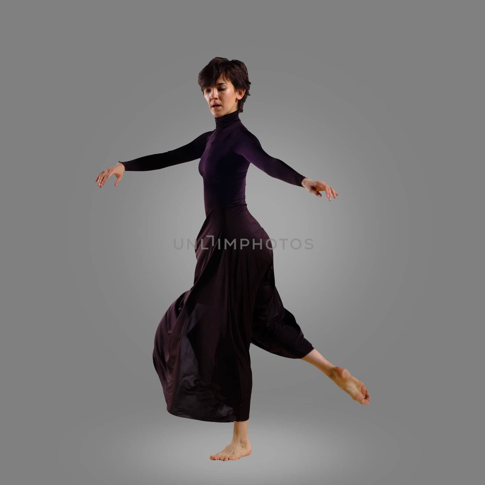 dancer on a gray background , motion
