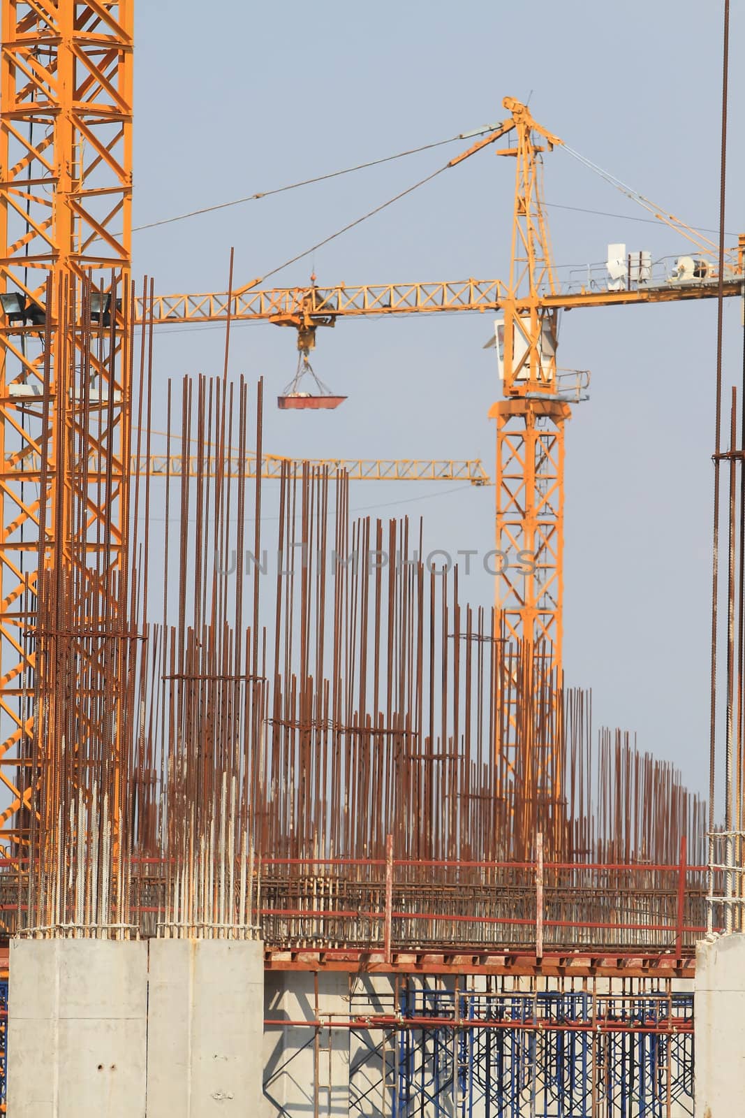 Construction site with enforced concrete steel frames rising up