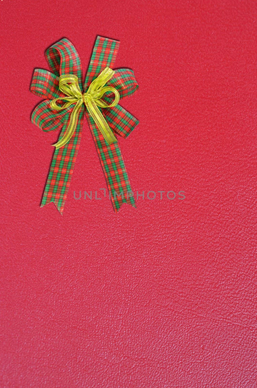 Gift bow on red background