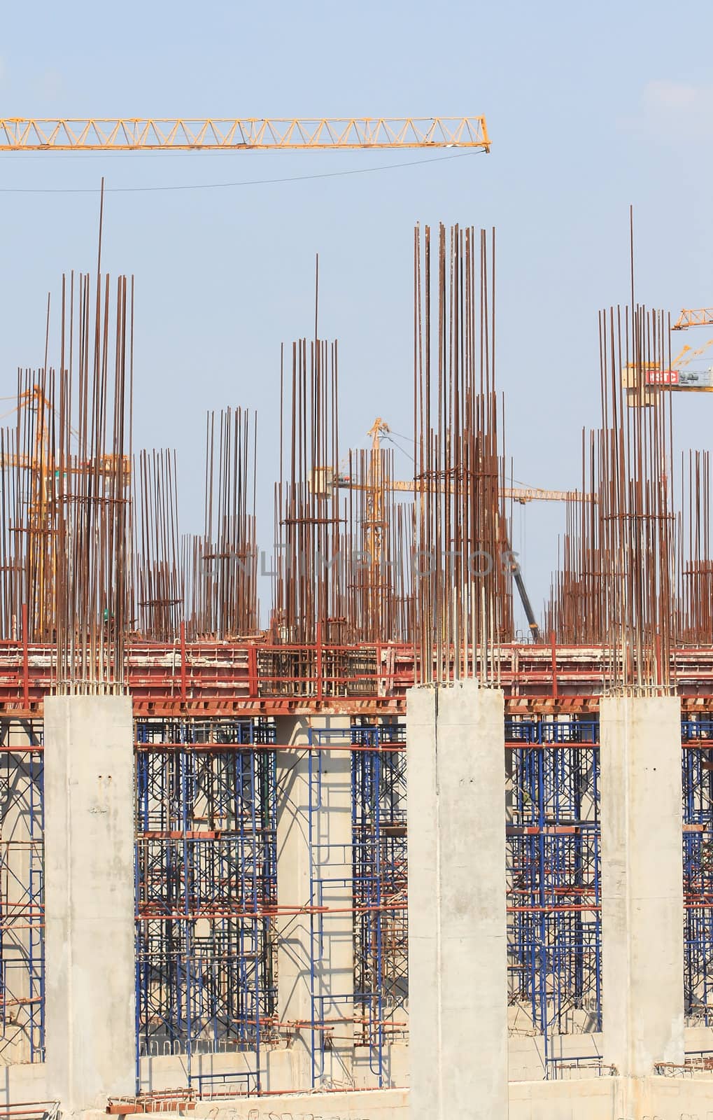 Construction site with enforced concrete steel frames rising up