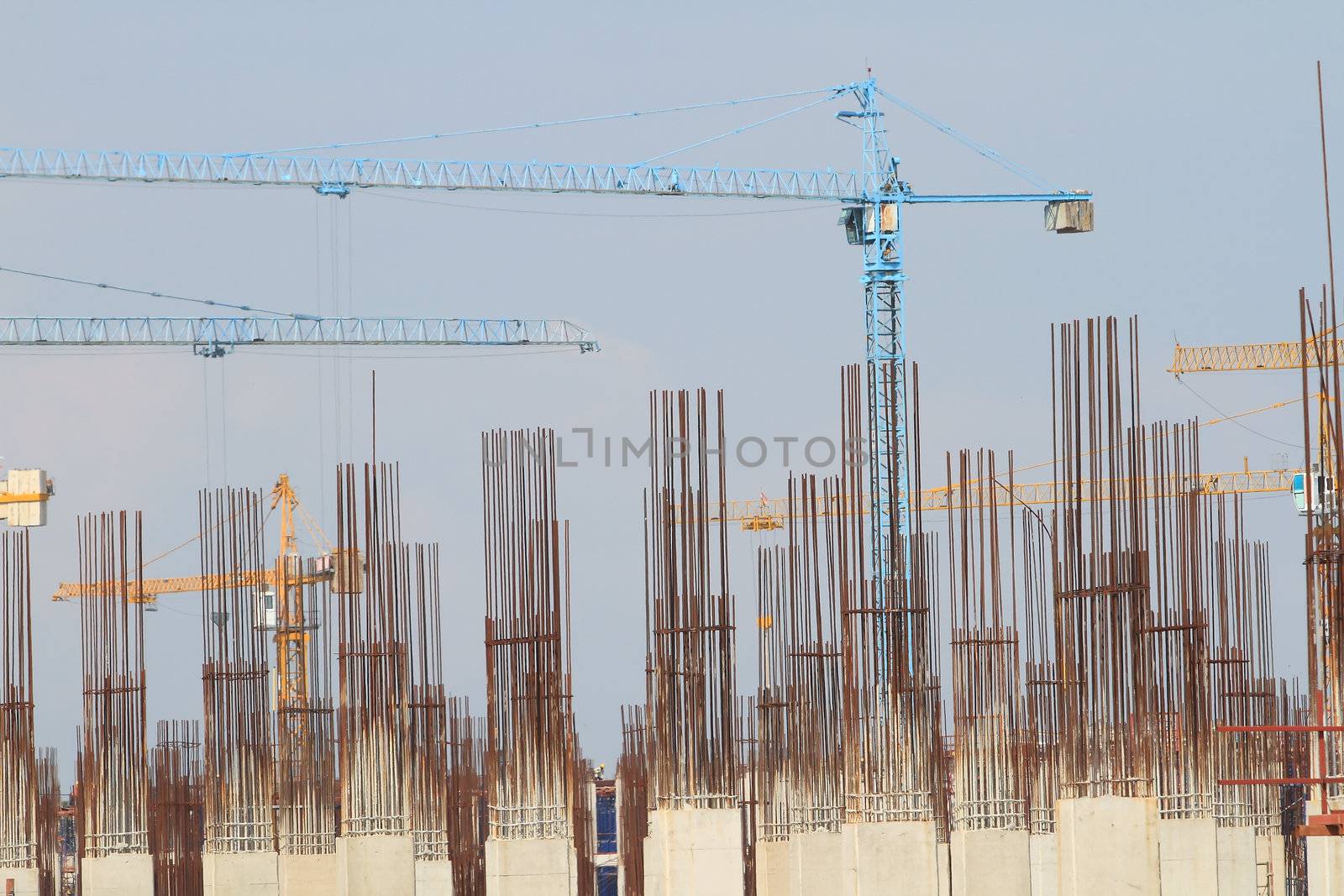 Construction site with enforced concrete steel frames rising up