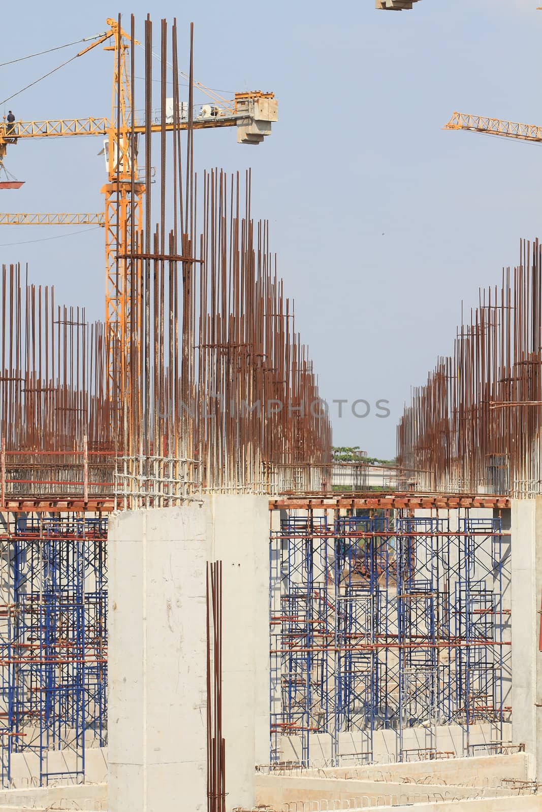 Construction site with enforced concrete steel frames rising up