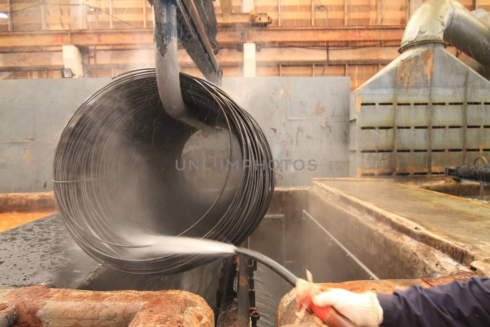 Large spools of Steel Coils being moved.